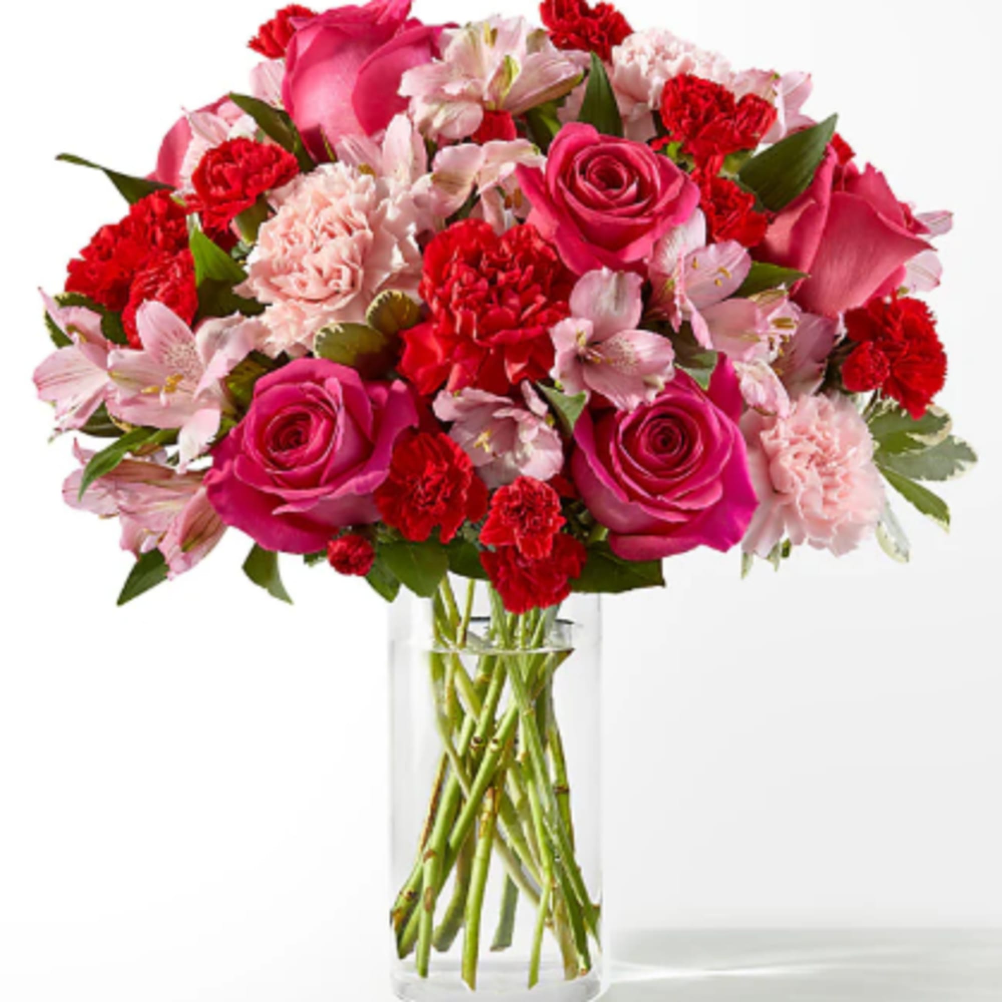 Blushing shades of pink blooms, nestled in lush greenery, are sure to