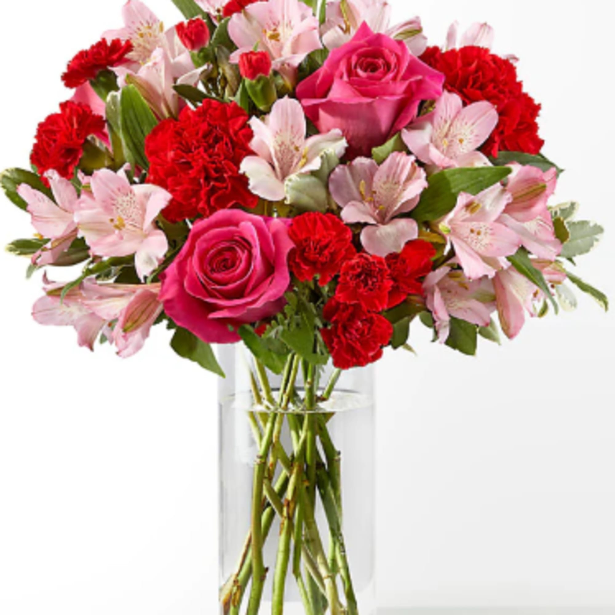 Blushing shades of pink blooms, nestled in lush greenery, are sure to