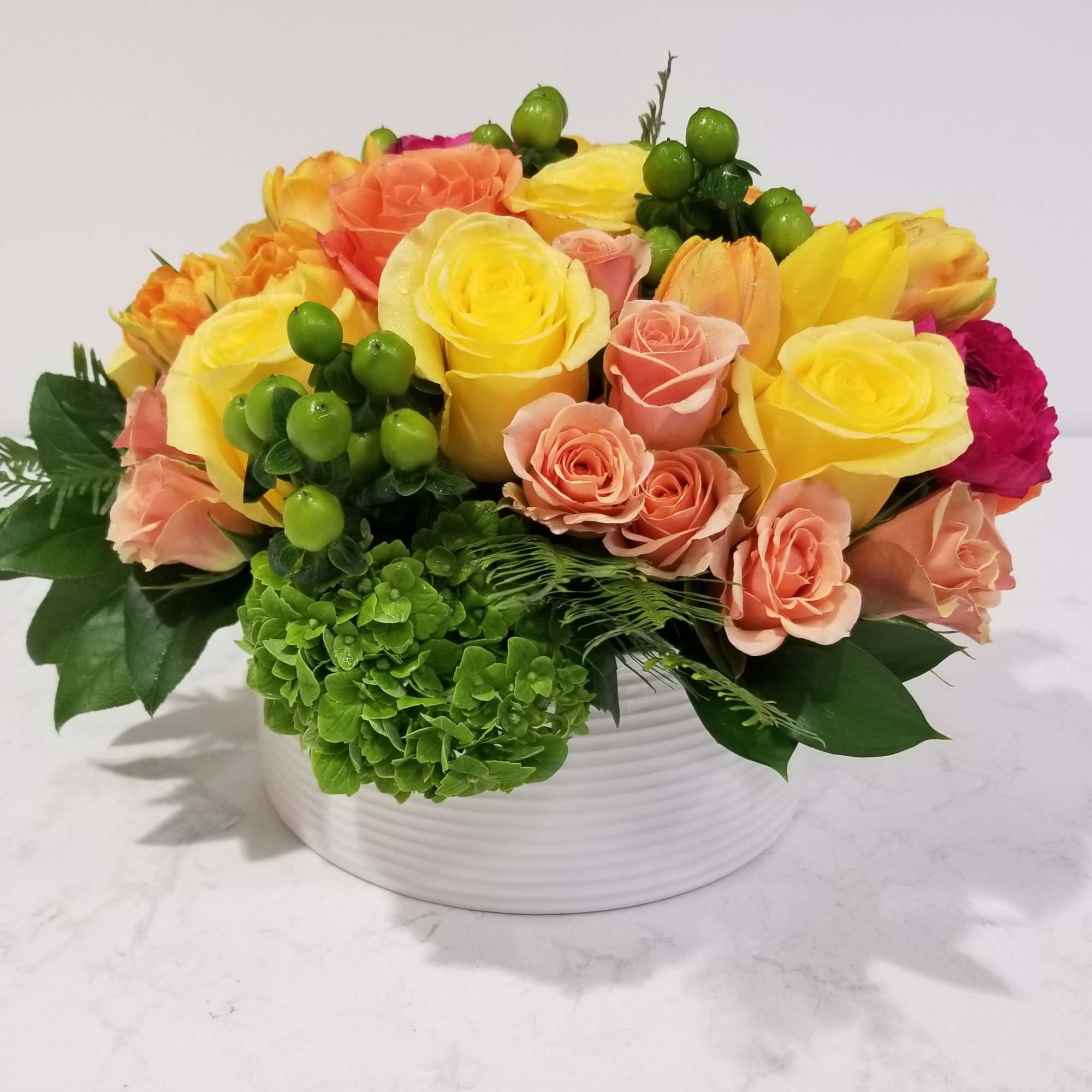A low, compact, lovely garden arrangement. Perfect for a desk or office. A low, compact, lovely garden arrangement. Perfect for a desk or office.
