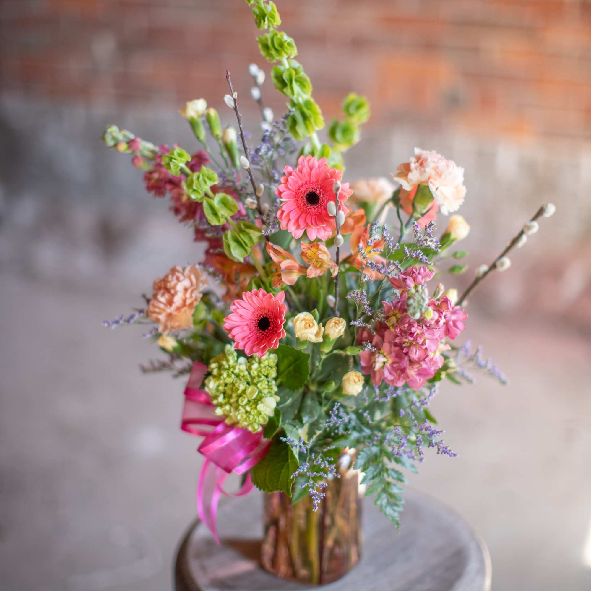A wildflower mix in a textured glass vase. This mix of standard