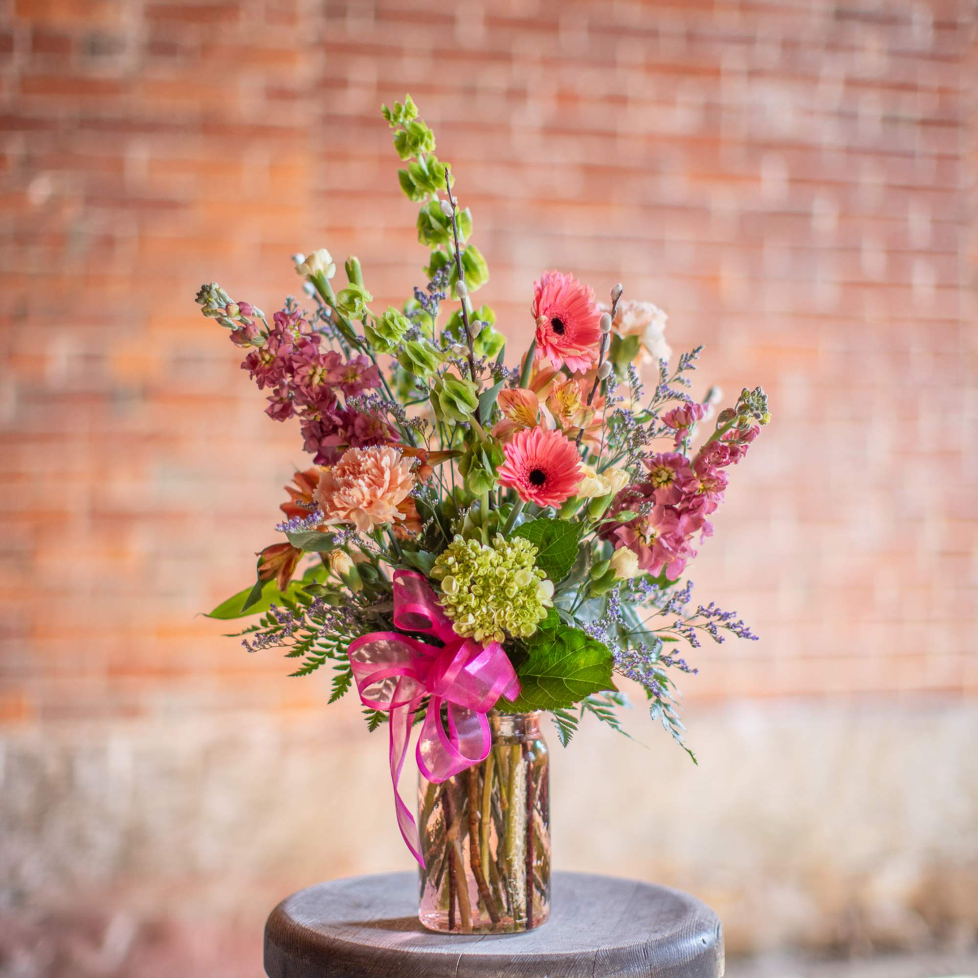 A wildflower mix in a textured glass vase. This mix of standard