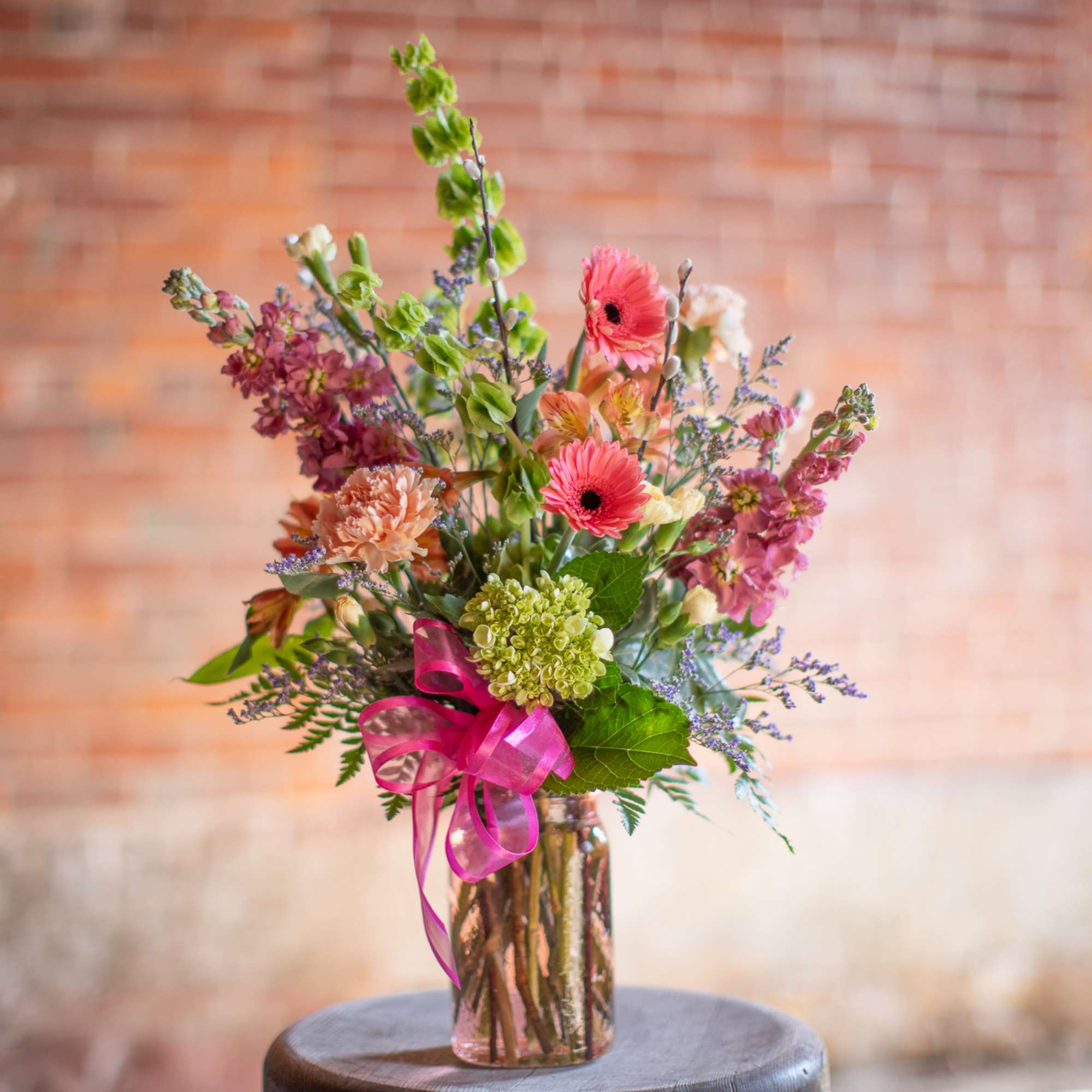 A wildflower mix in a textured glass vase. This mix of standard