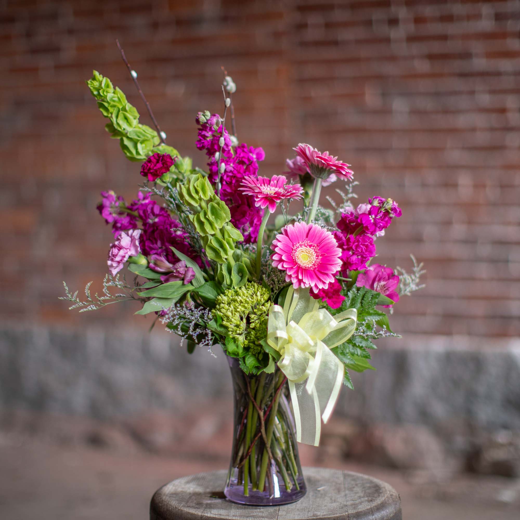 A wildflower mix in a textured glass vase. This mix of standard