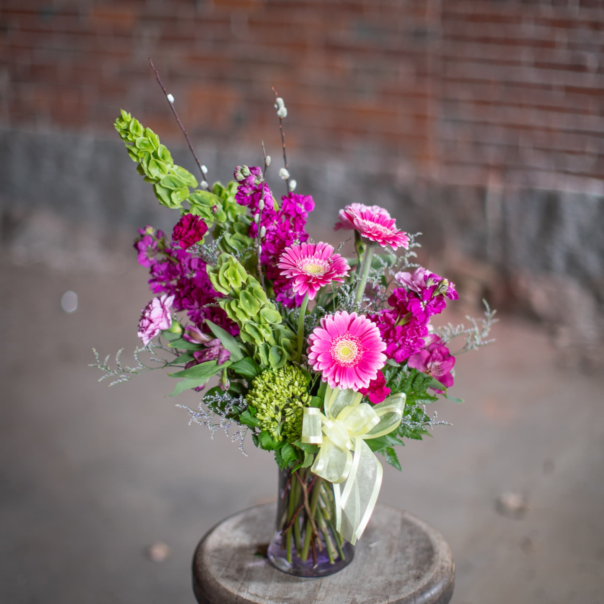 A wildflower mix in a textured glass vase. This mix of standard