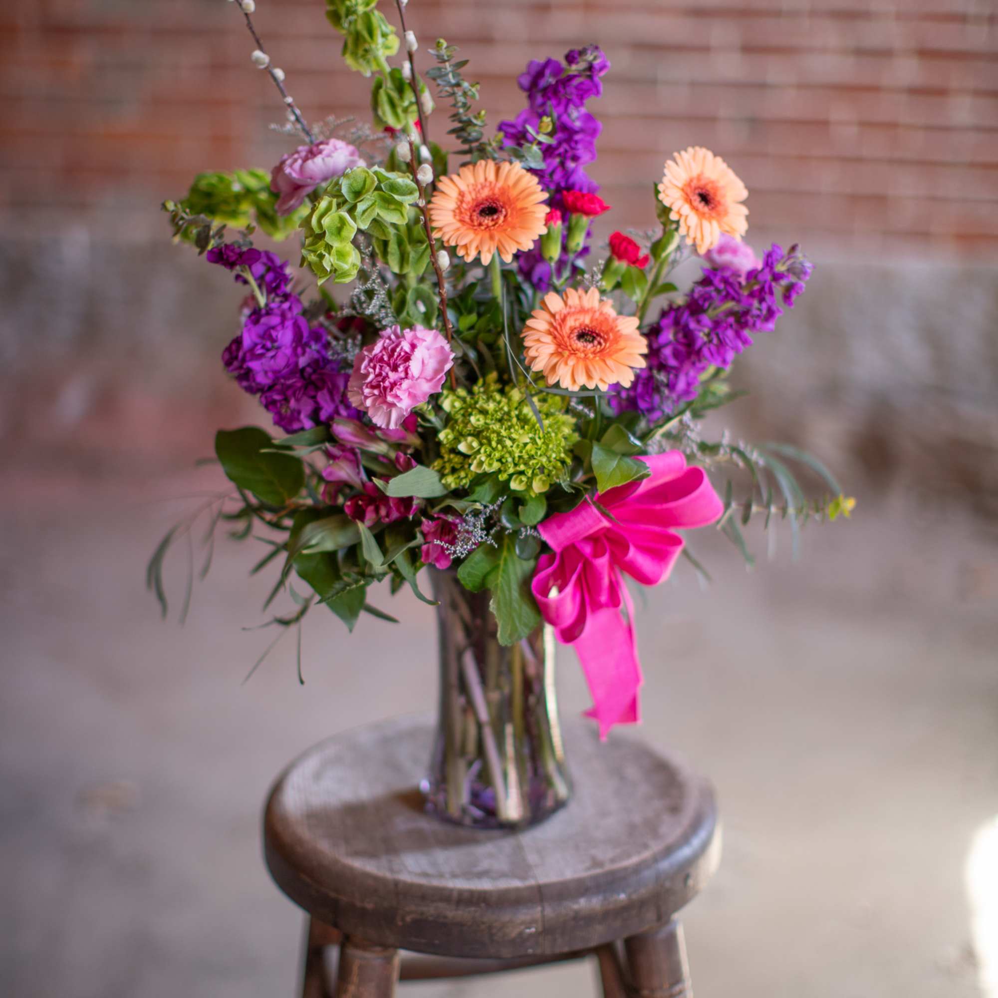 A wildflower mix in a textured glass vase. This mix of standard