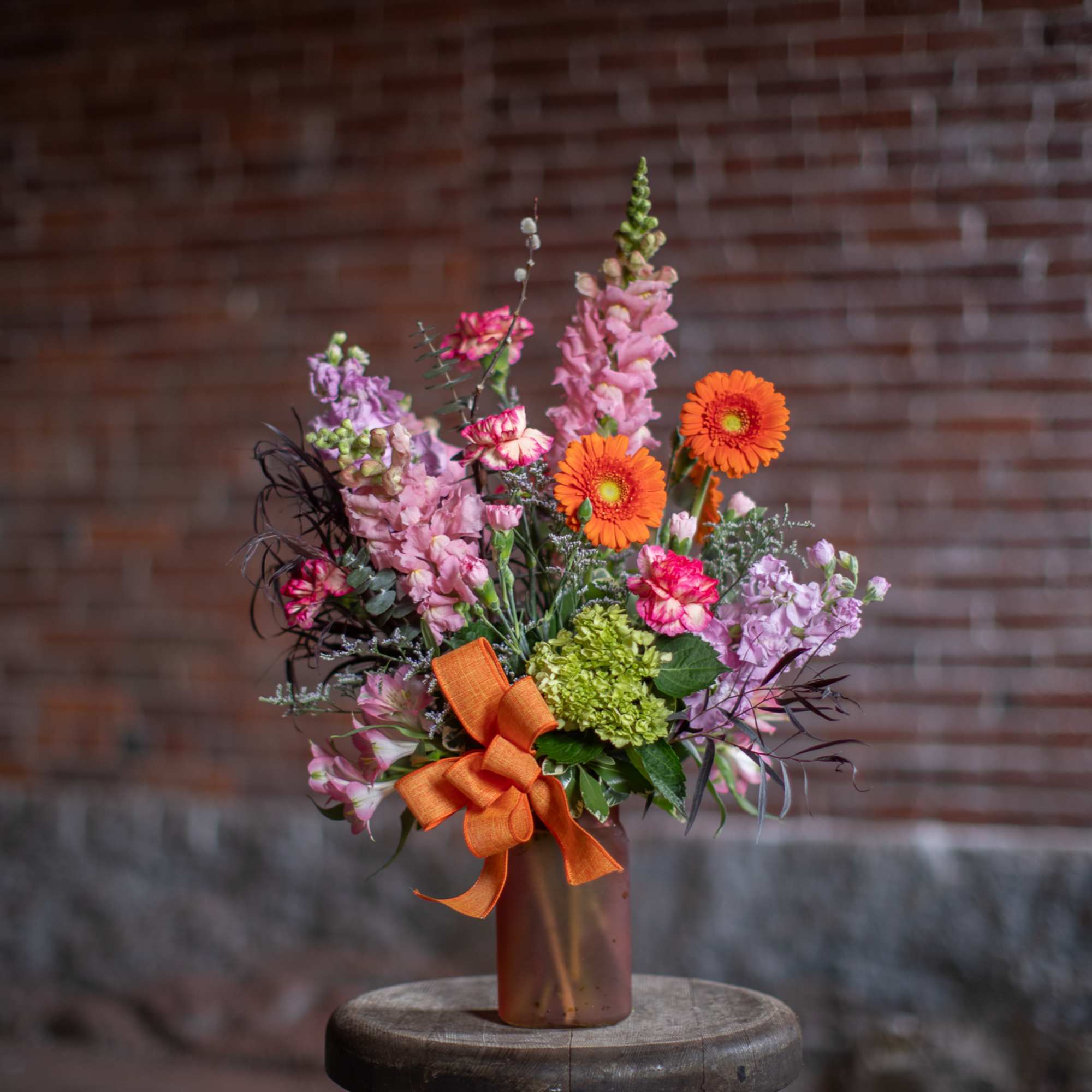 A wildflower mix in a textured glass vase. This mix of standard