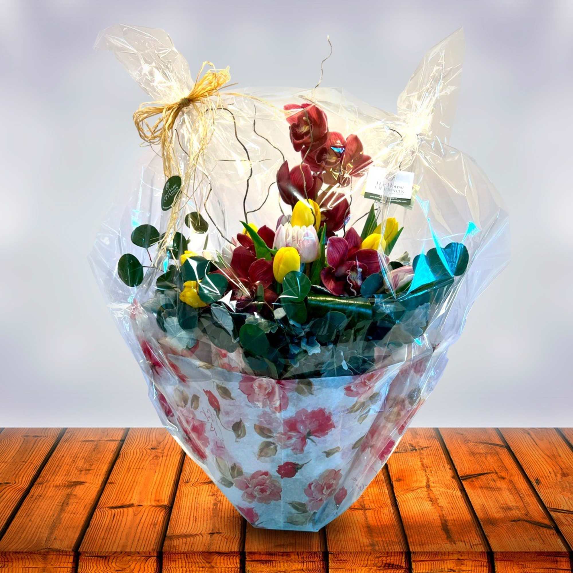 Send a selection of tulips and orchids to welcome someone you care