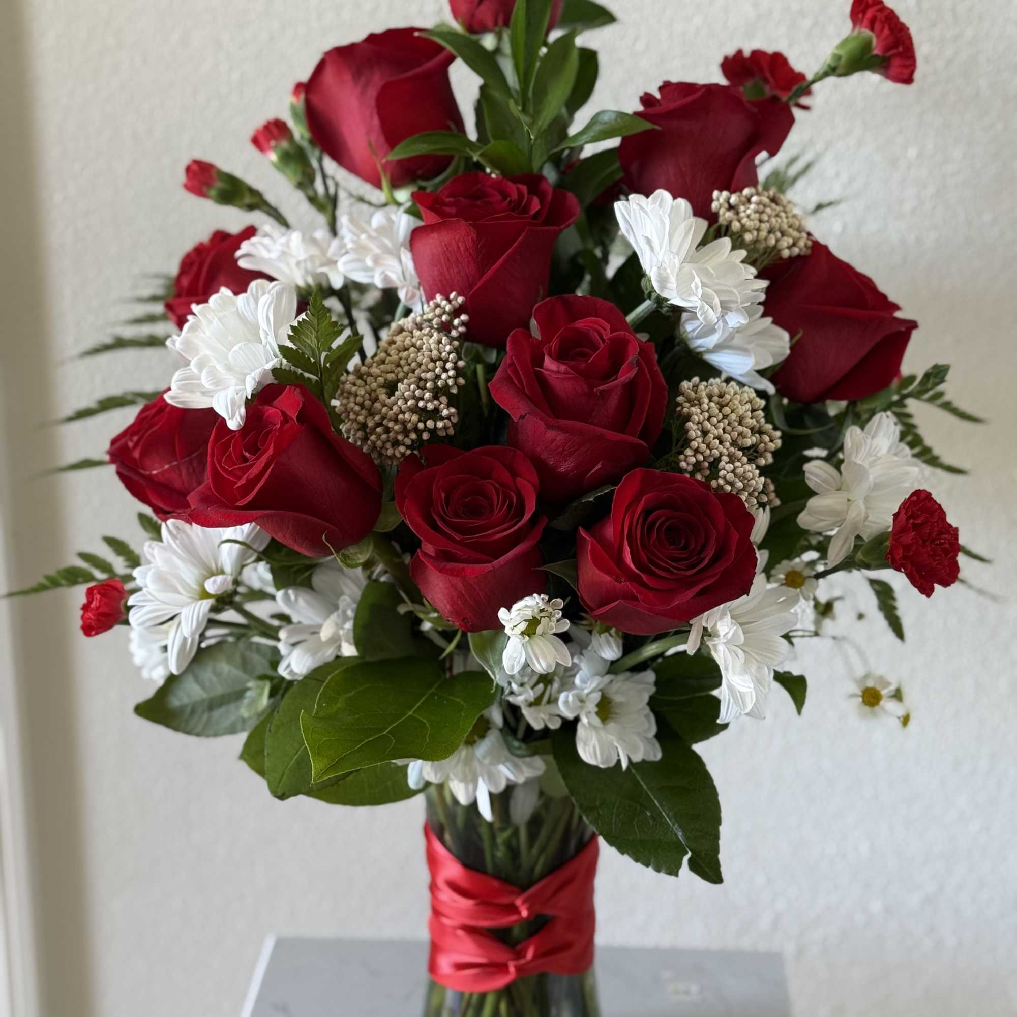 Whispers of Love is a romantic arrangement designed exclusively by Lovely Flowers