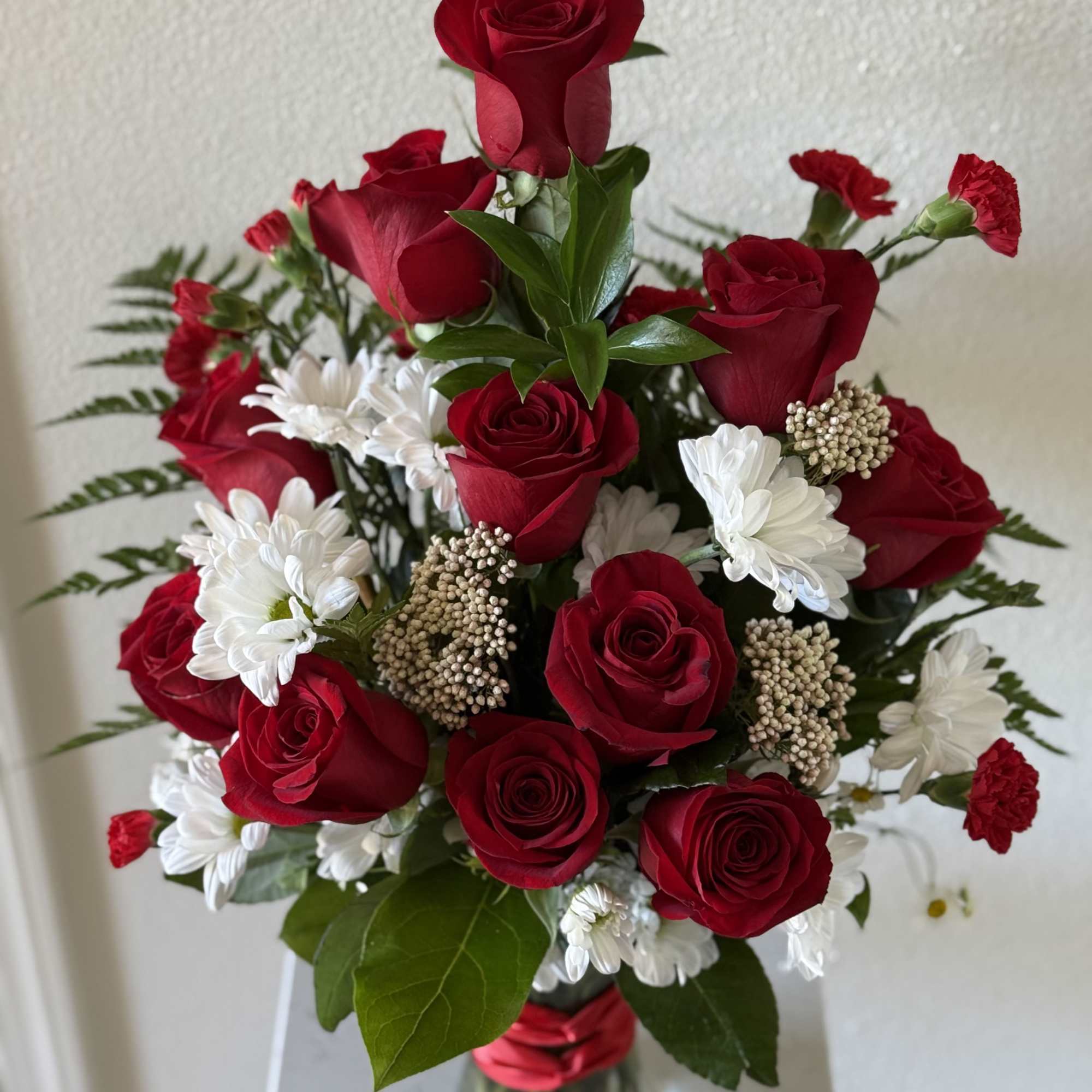 Whispers of Love is a romantic arrangement designed exclusively by Lovely Flowers