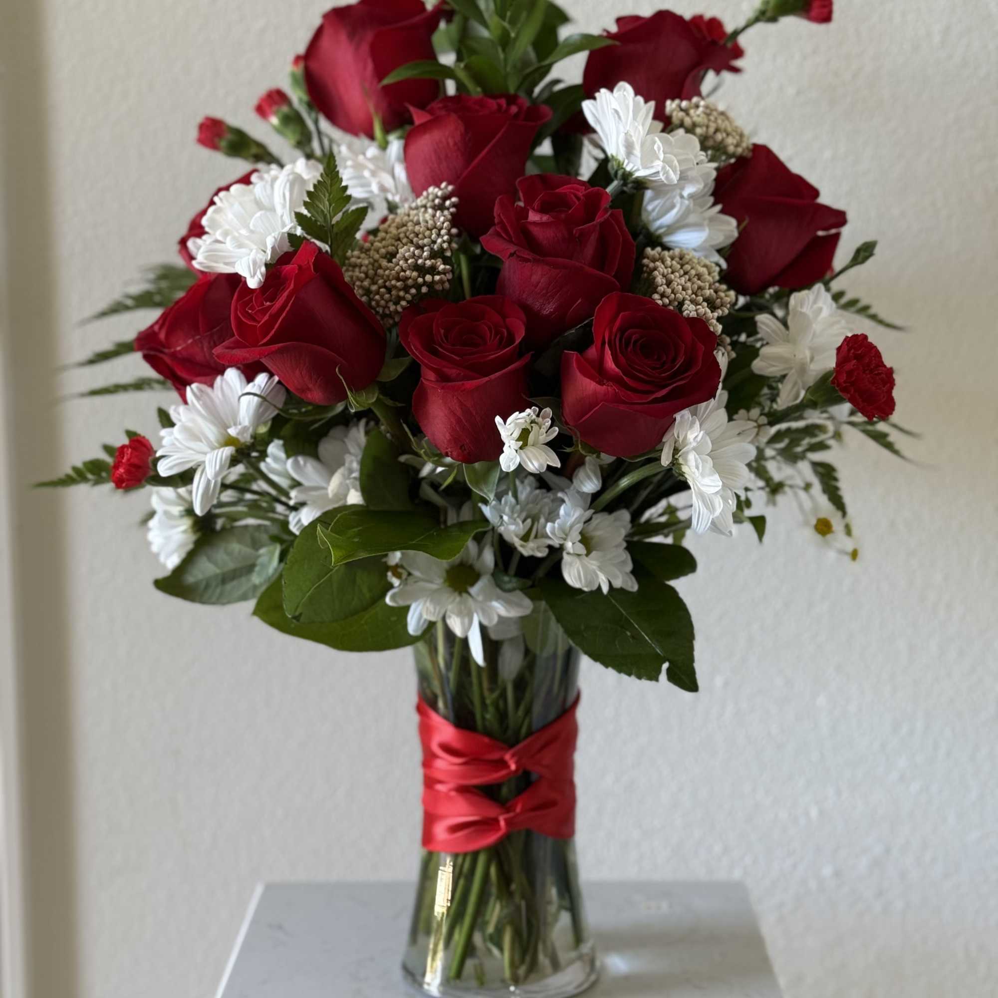 Whispers of Love is a romantic arrangement designed exclusively by Lovely Flowers