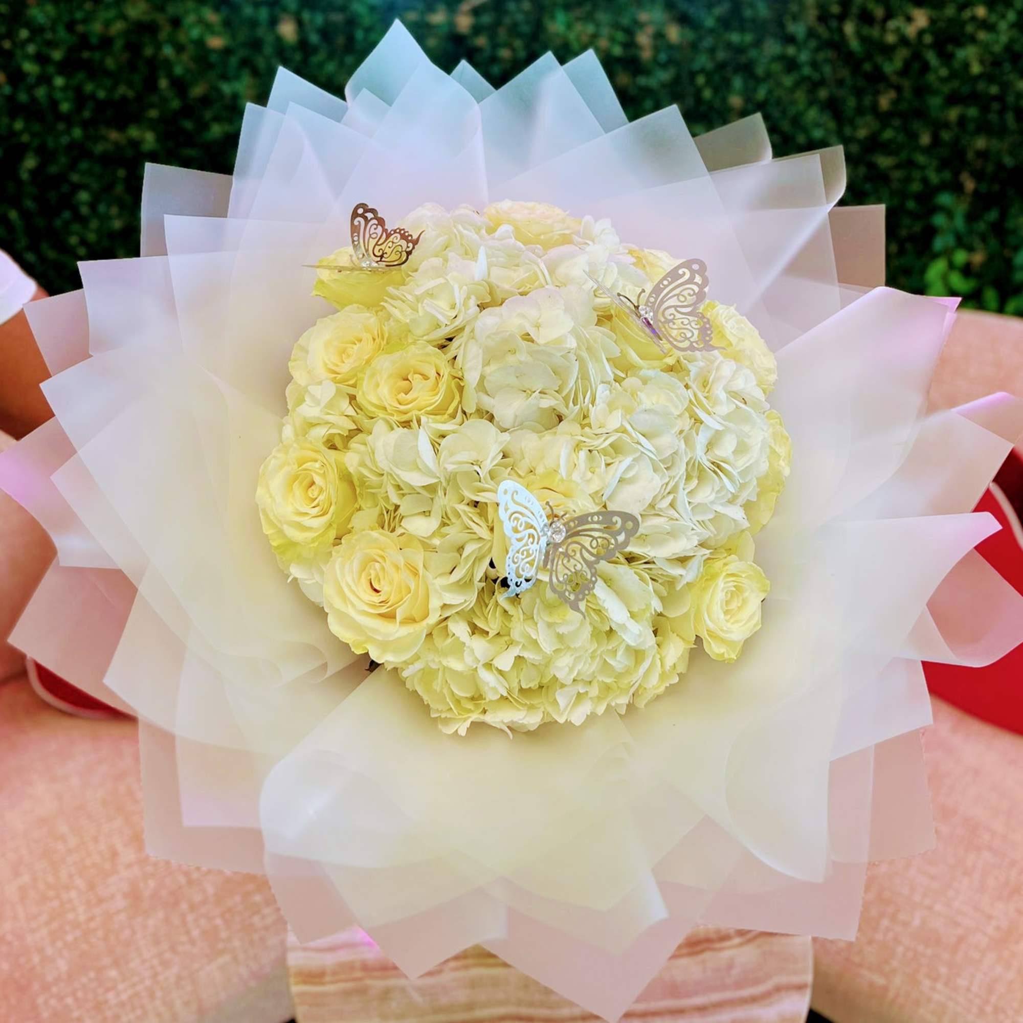 A classic and timeless arrangement featuring the delicate beauty of white hydrangeas