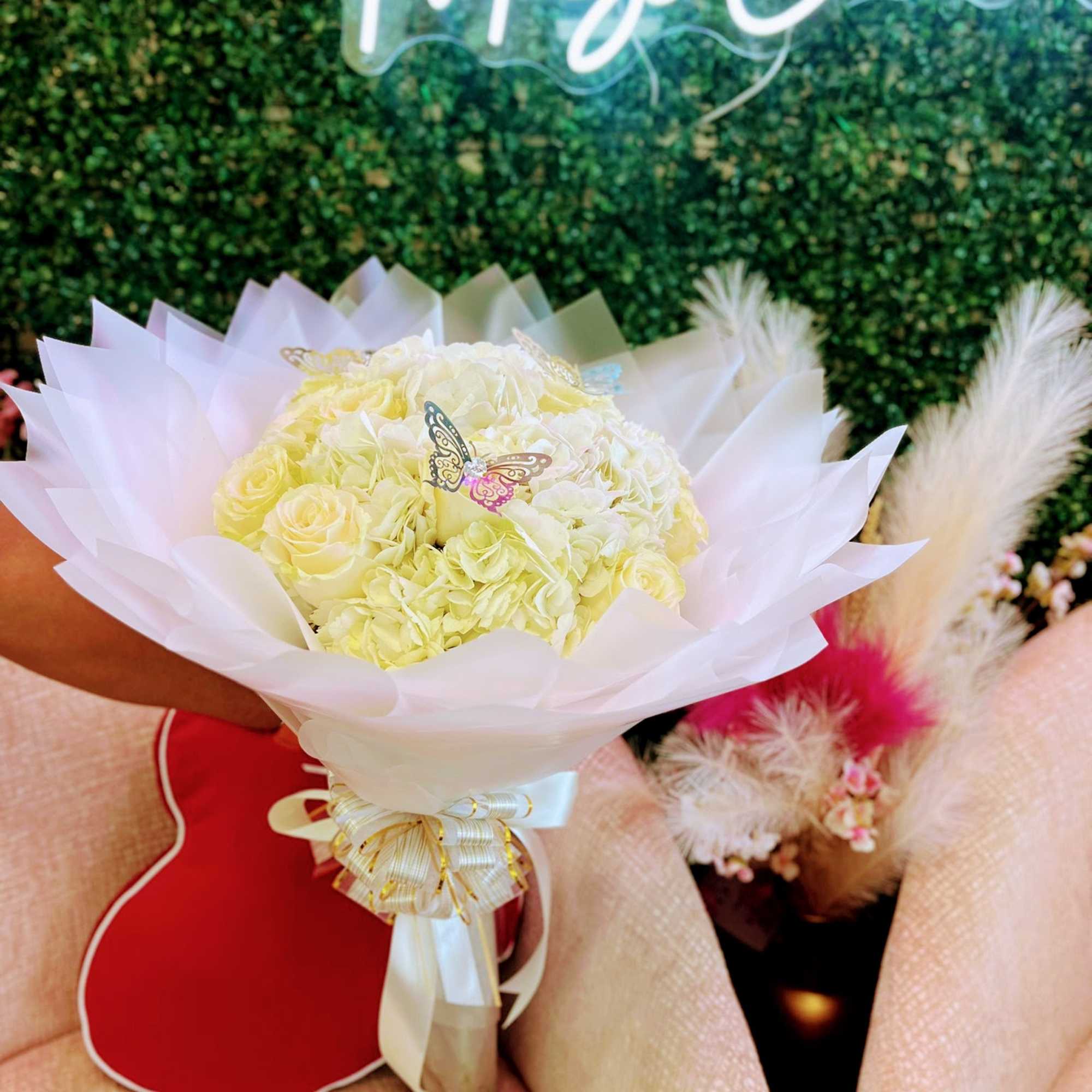 A classic and timeless arrangement featuring the delicate beauty of white hydrangeas