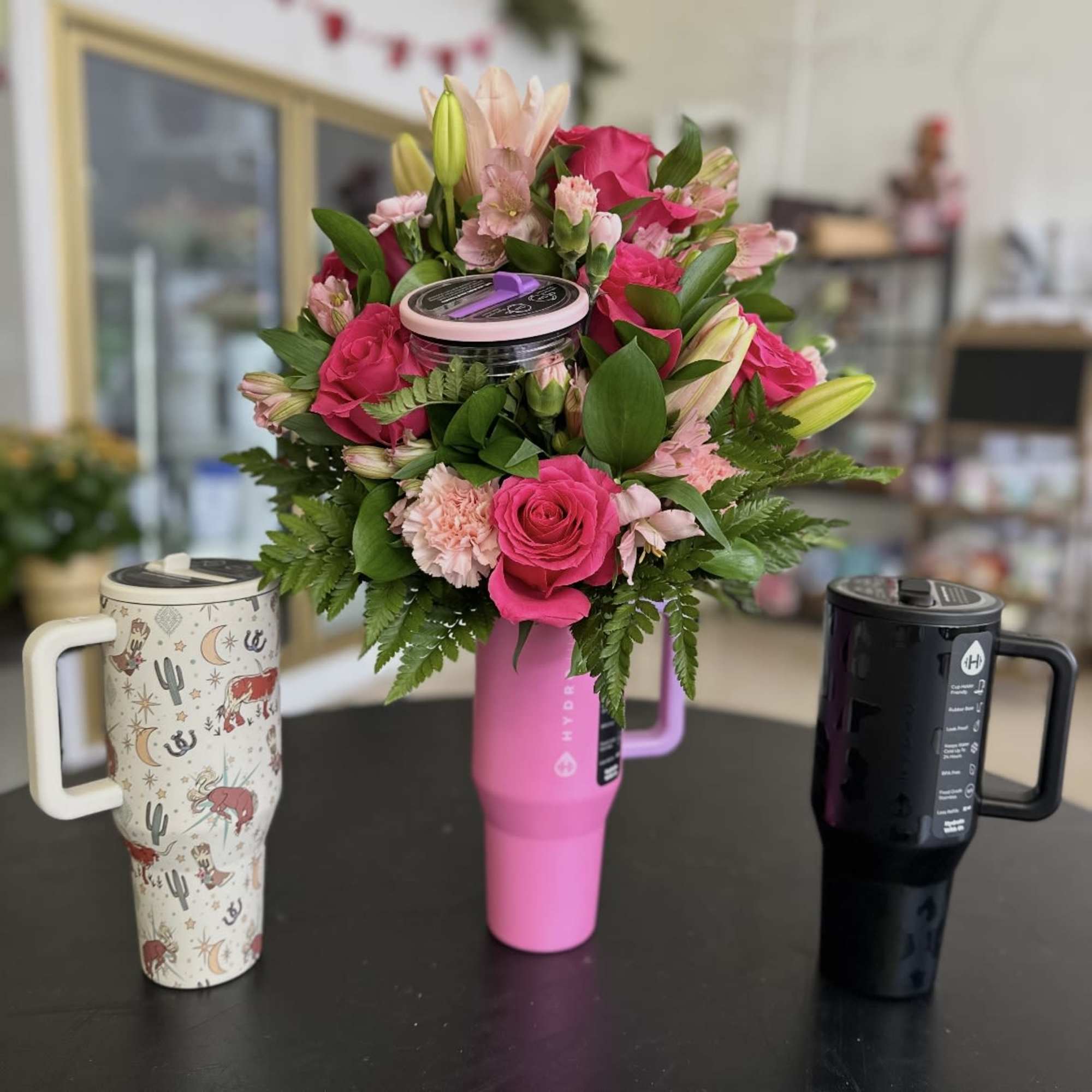 32 oz HydroJug Cup with a beautiful arrangement of flowers. (Types of