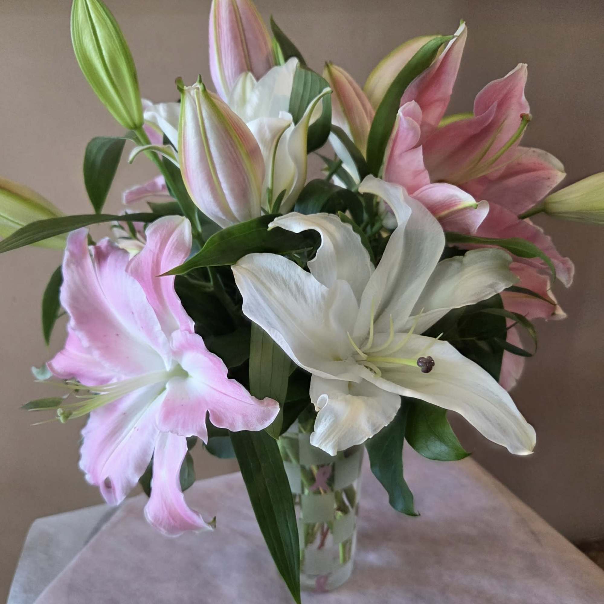 This all-lily arrangement, is a cheerful nod to Breast Cancer Awareness Month-
