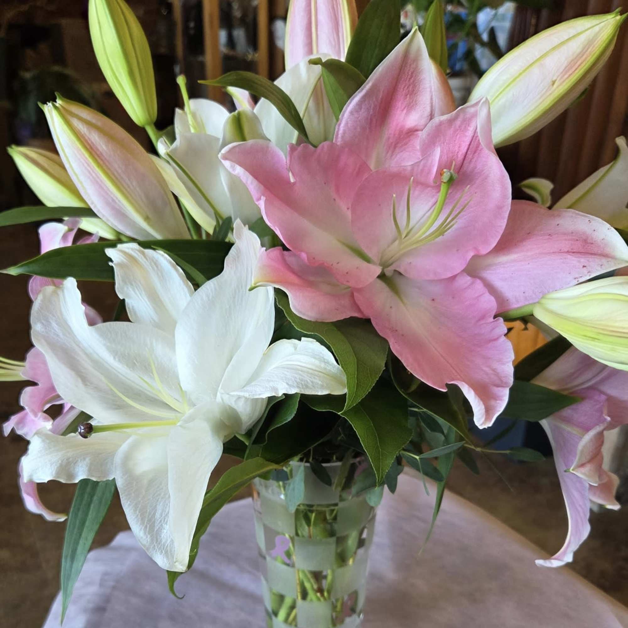 This all-lily arrangement, is a cheerful nod to Breast Cancer Awareness Month-