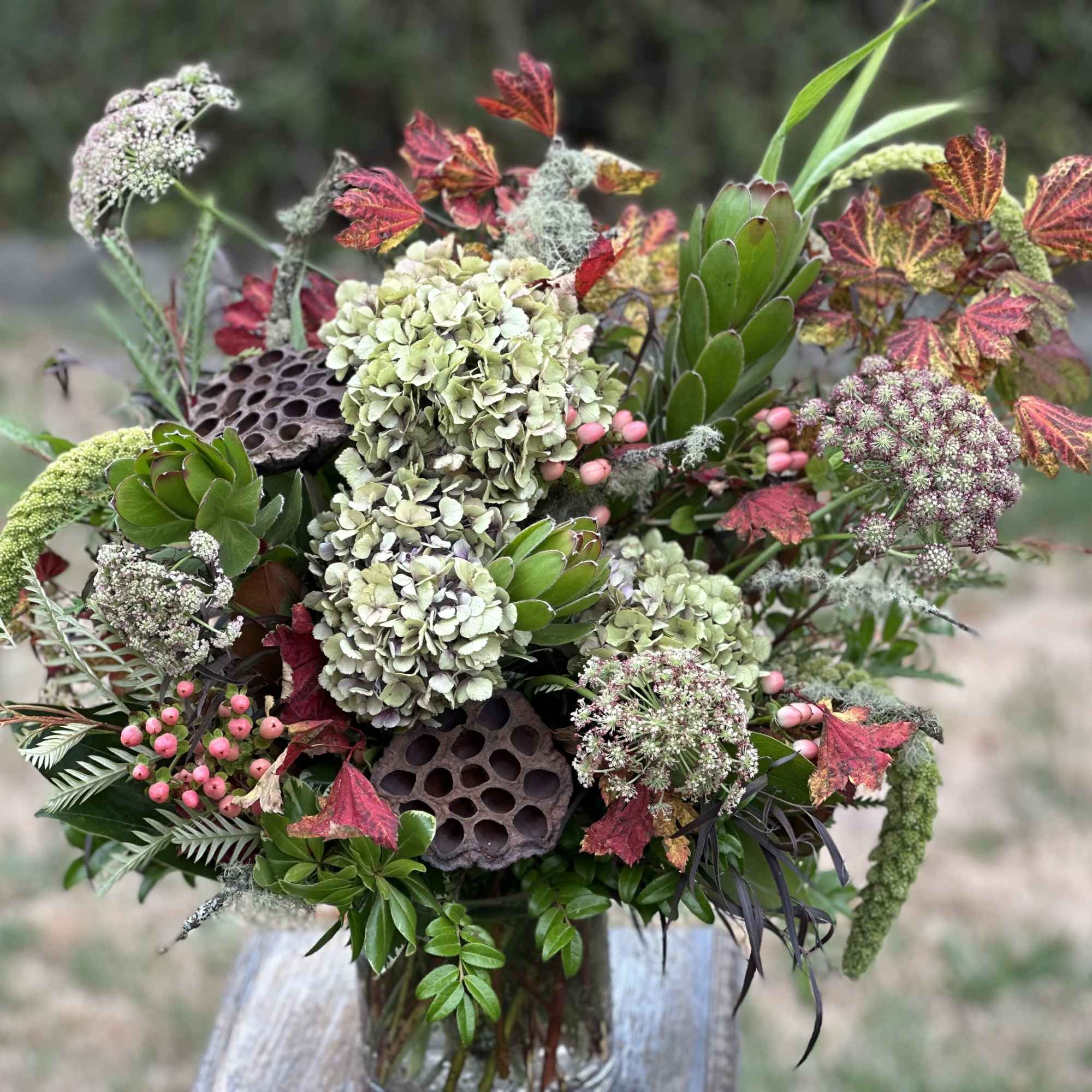 A Grand Foliage and Texture-Driven Bespoke arrangement Designed with Foraged Greens, and