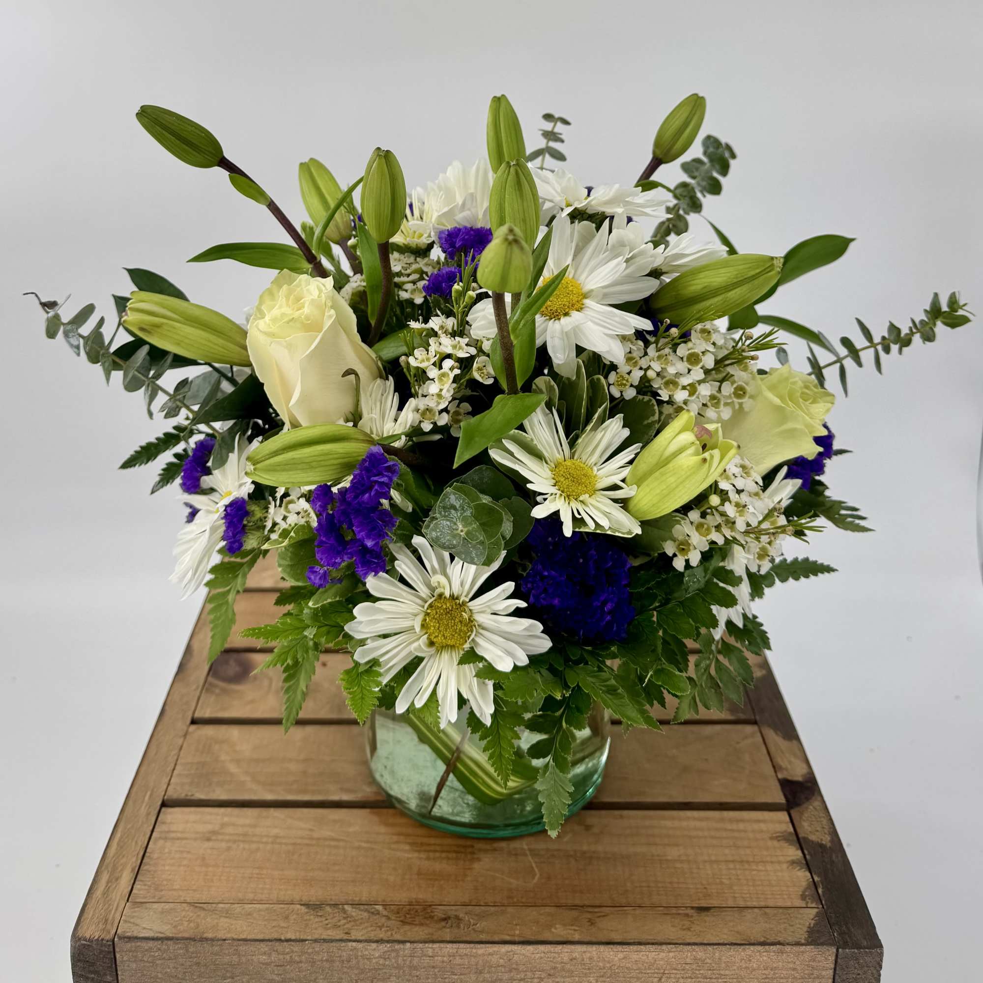 Capture the essence of elegance with our exquisite floral arrangement in a