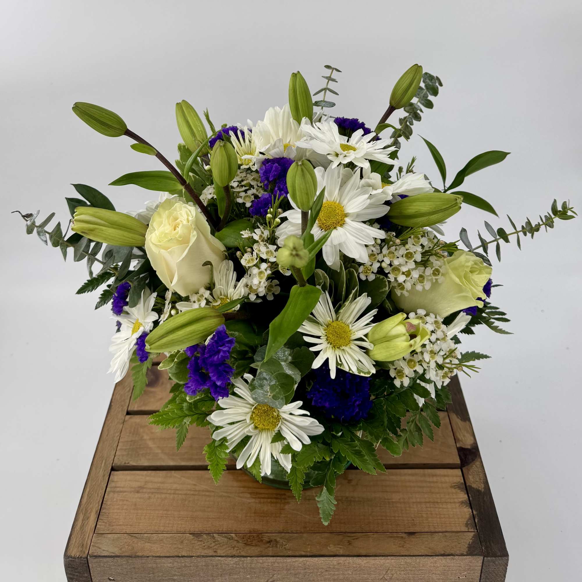 Capture the essence of elegance with our exquisite floral arrangement in a