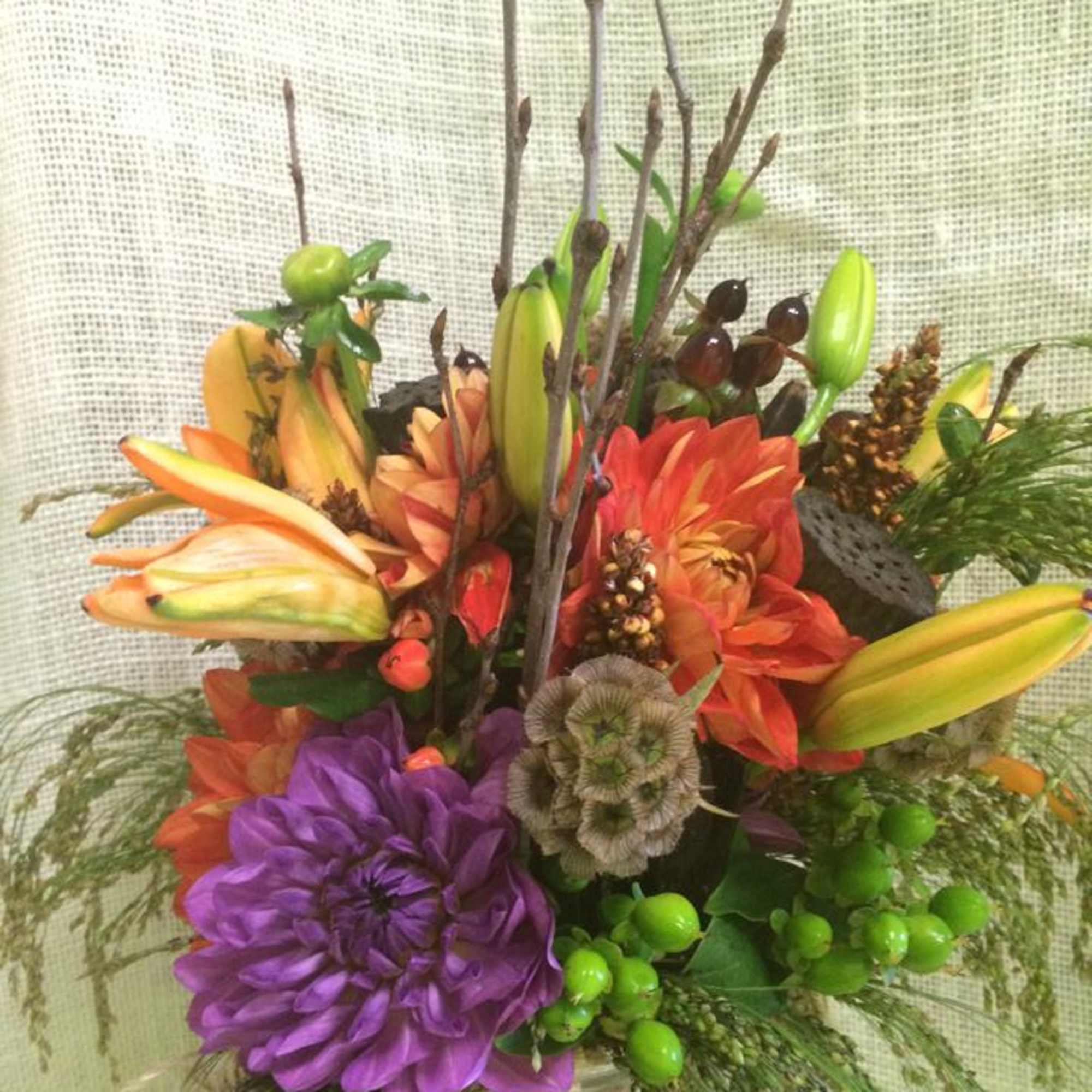 The colors and textures of fall inspire this robust arrangement, with a