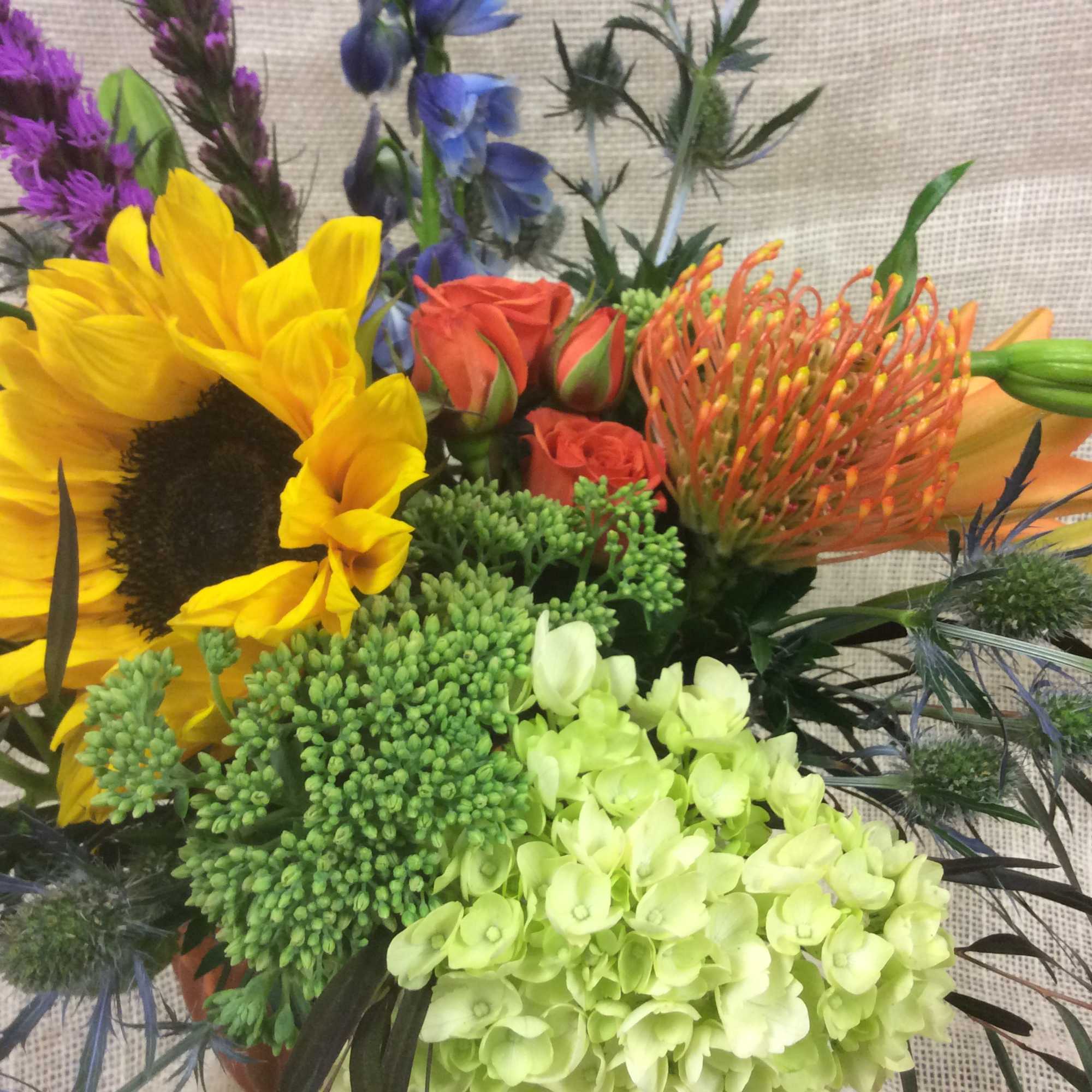 The colors and textures of fall inspire this robust arrangement, with a