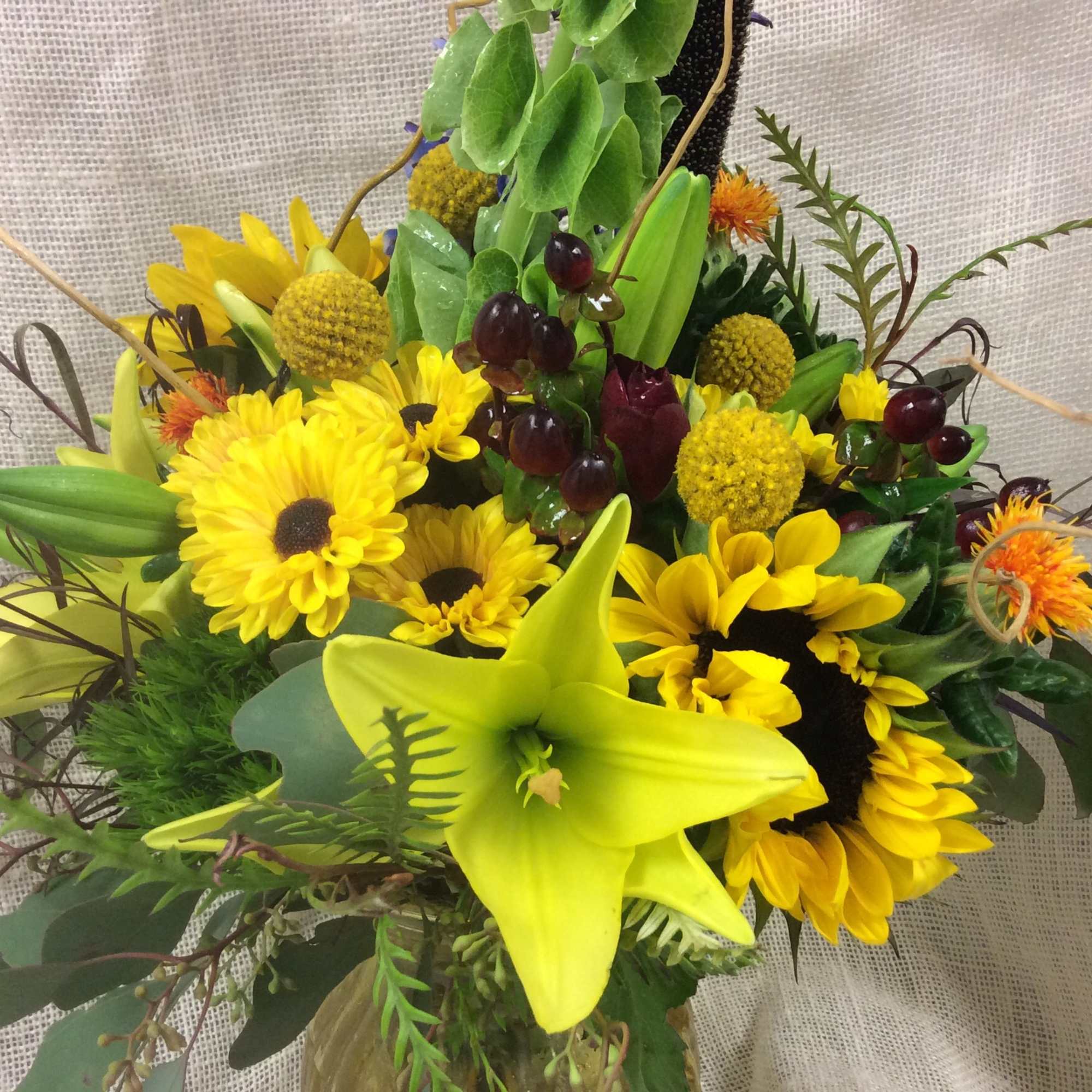 The colors and textures of fall inspire this robust arrangement, with a