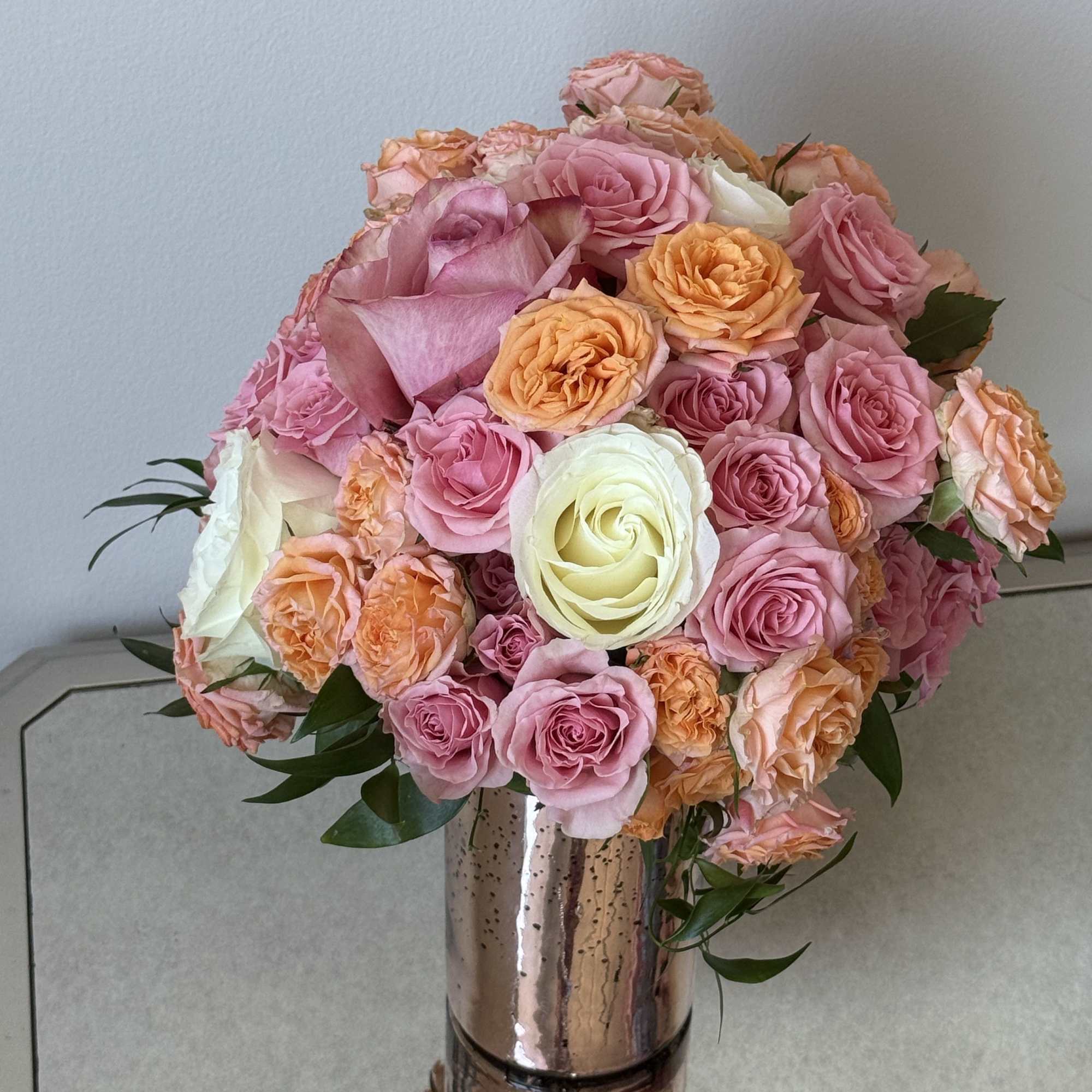 A bouquet of bright, warm roses that feels like a little piece