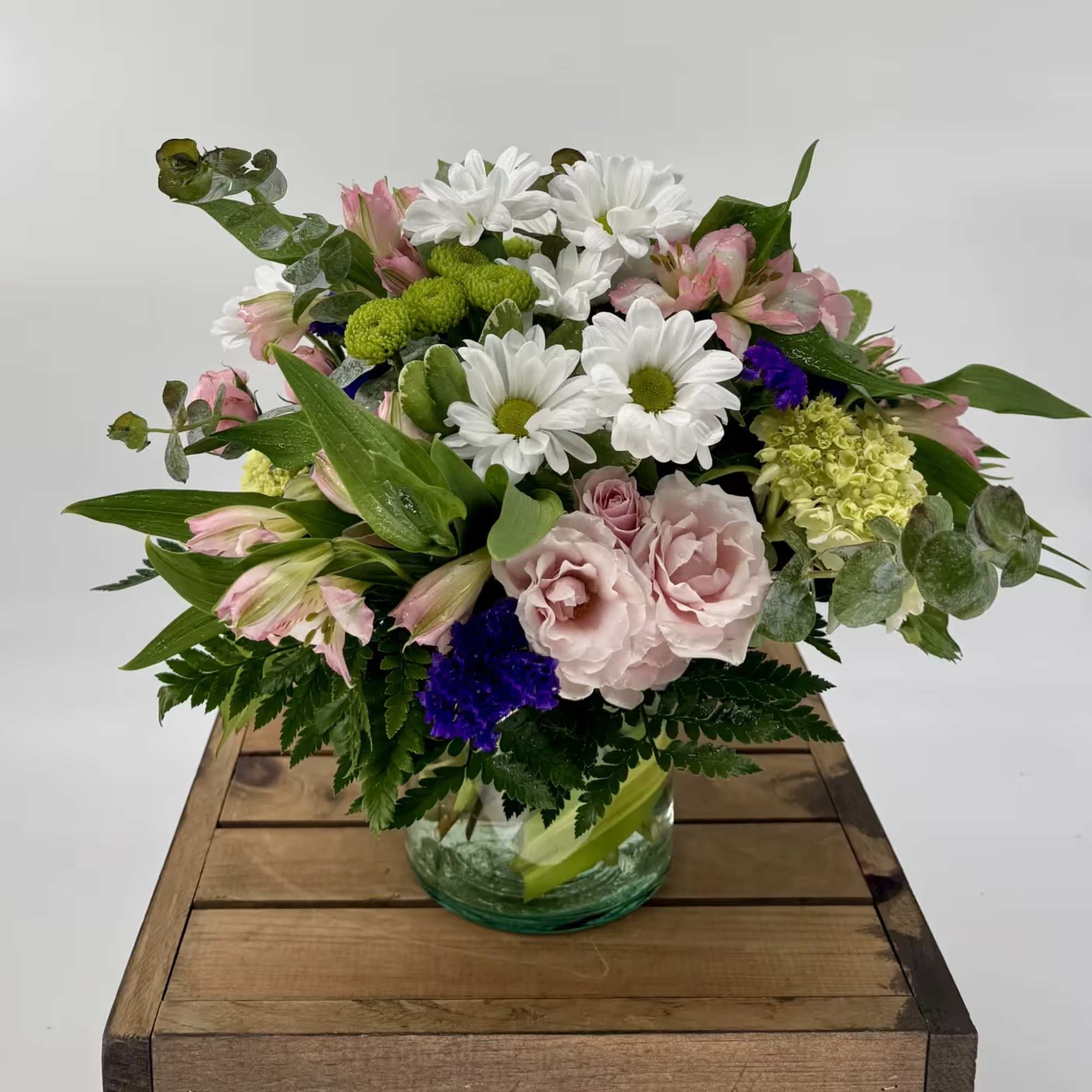 Our charming Fluttering Light flower arrangement, filled with green hydrangea, pink spray