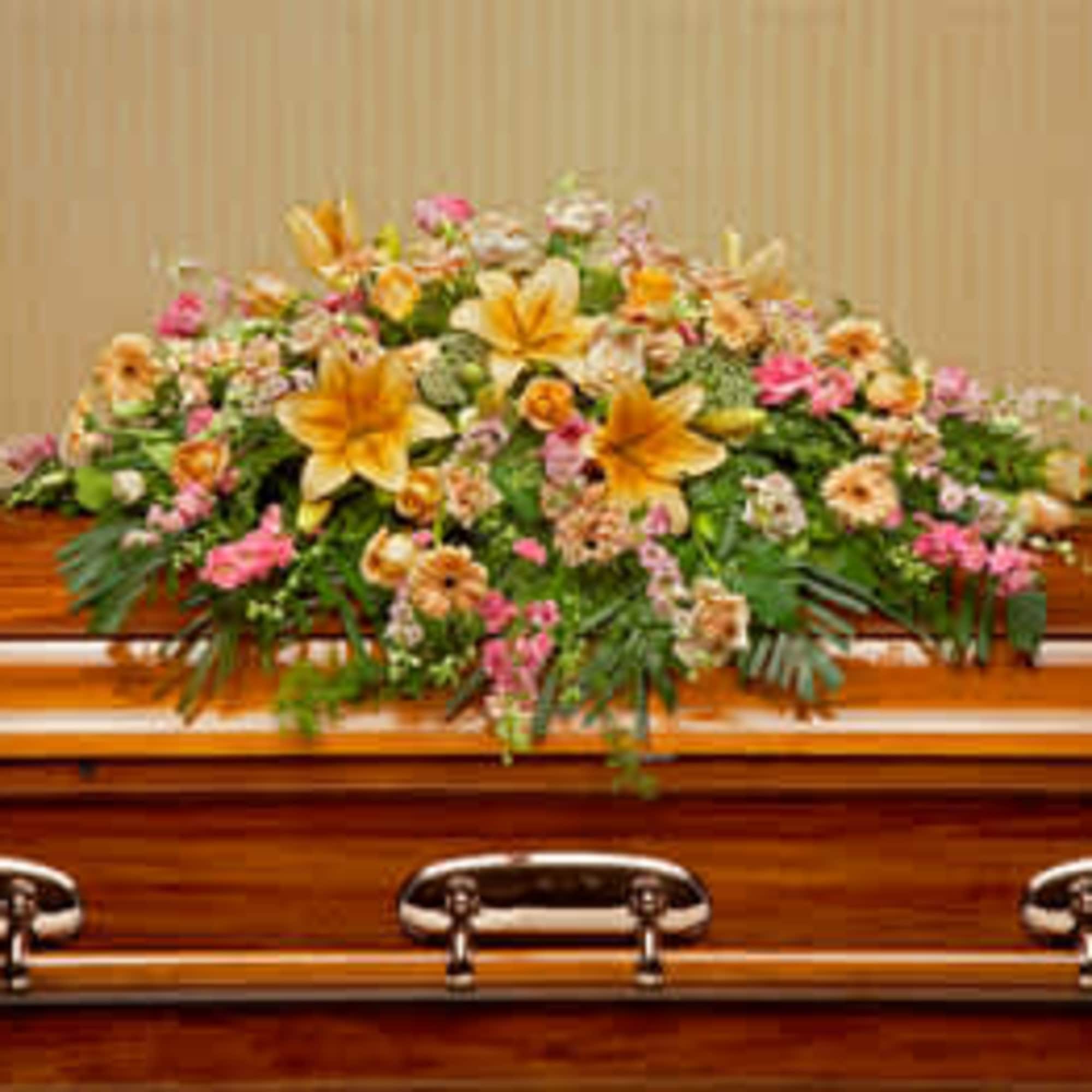 Create a vibrant and uplifting tribute with our casket spray cover adorned