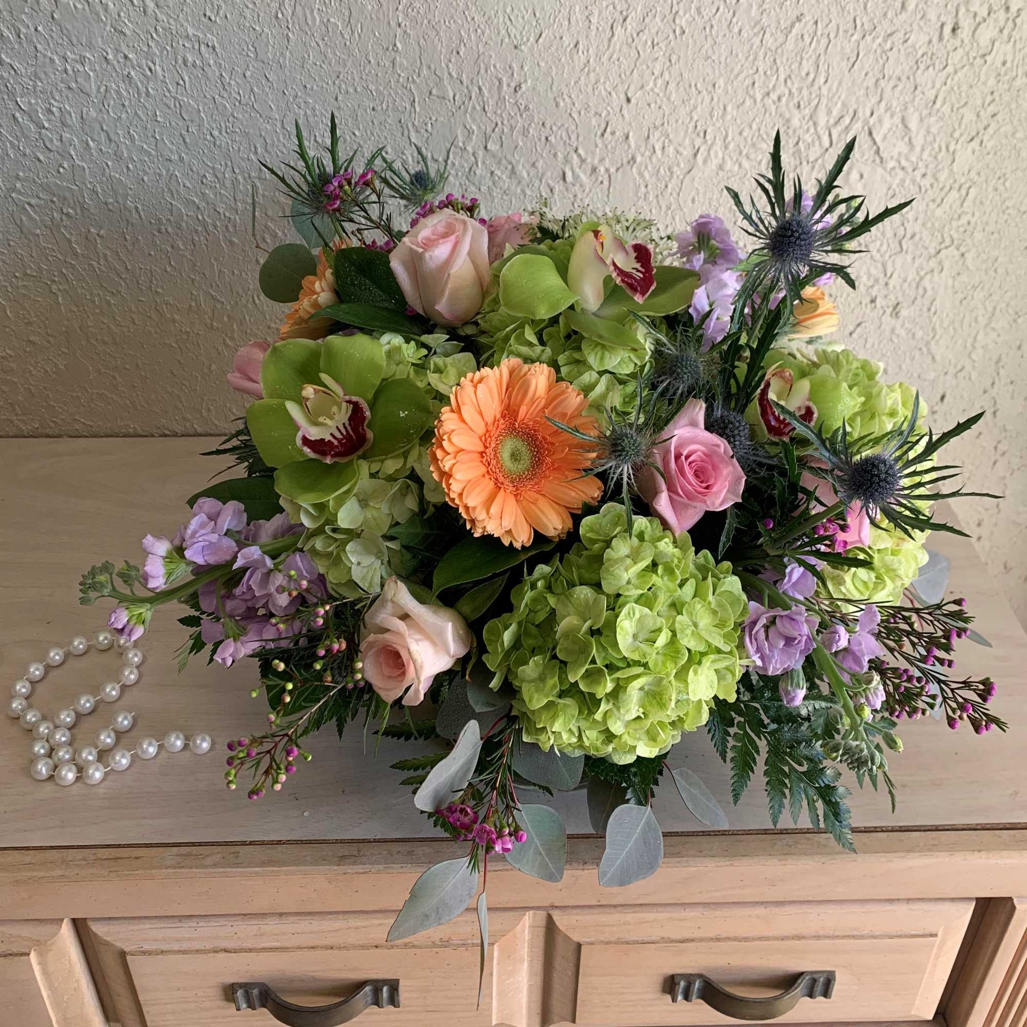 Elevate your space with our stunning and unique modern floral arrangement. This