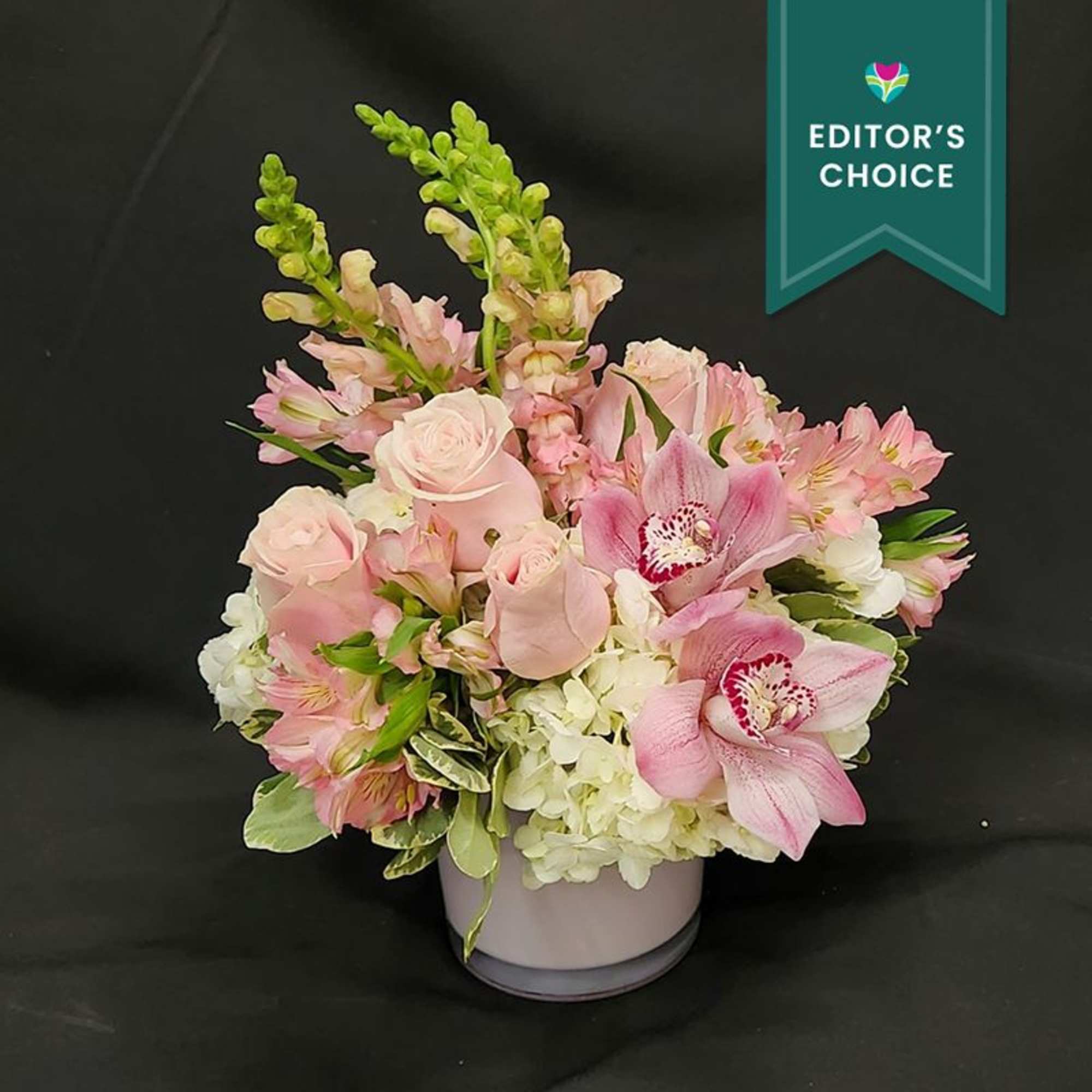 A Fabulous mix of Hydrangea, roses and cymbidium blooms.  Hand Designed