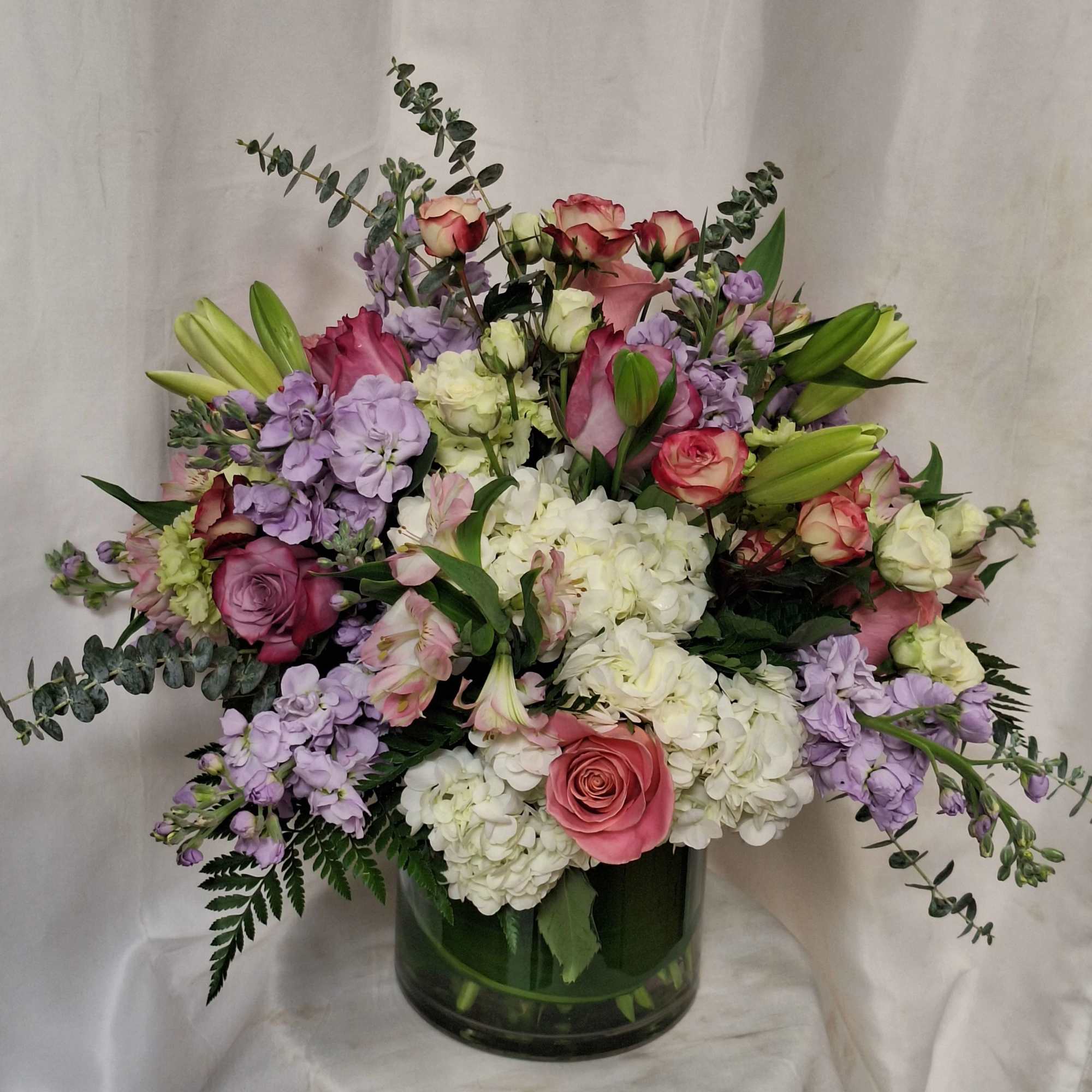 Introducing our premium floral arrangement, dazzling with shades of green, white, pink