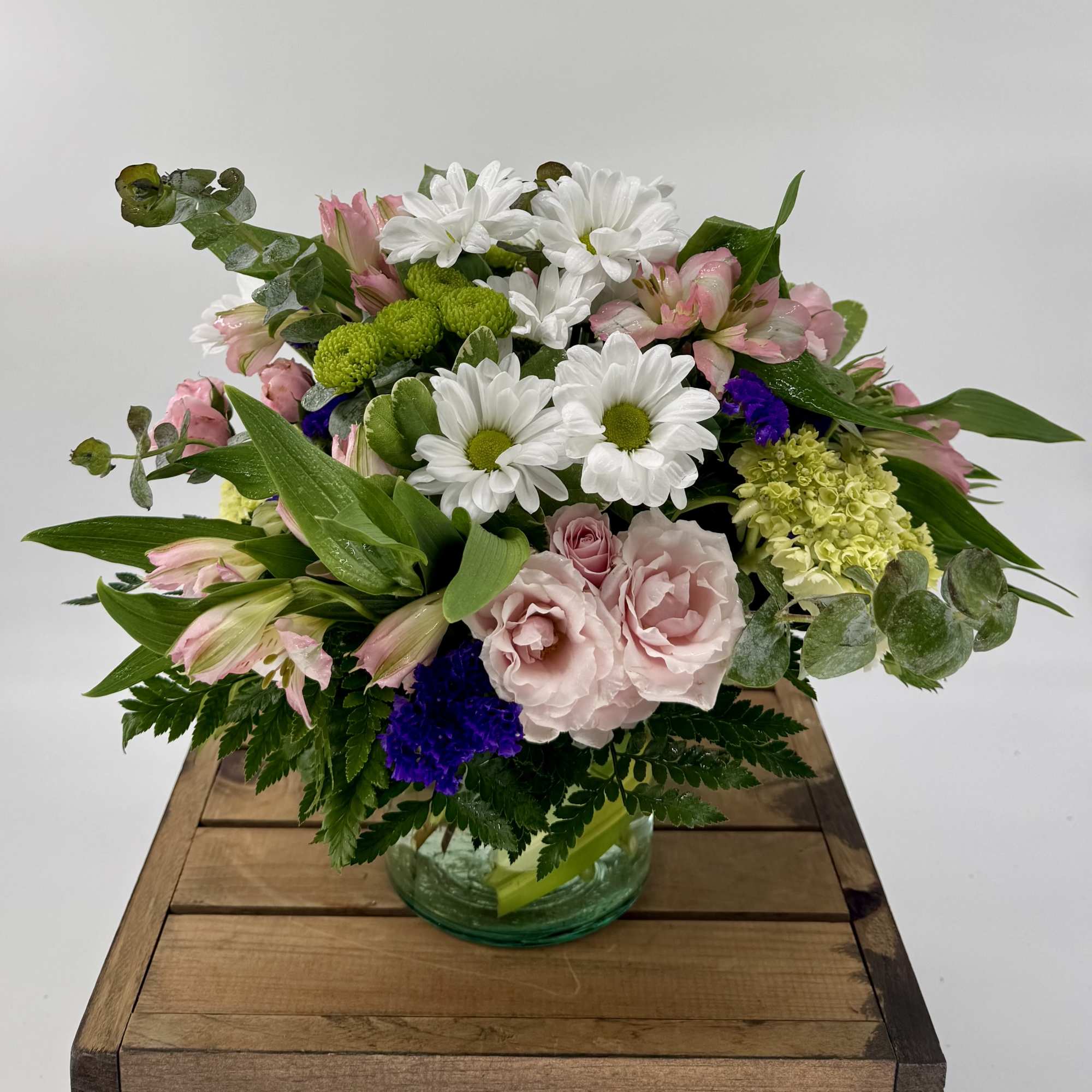 Our charming Fluttering Light flower arrangement, filled with green hydrangea, pink spray