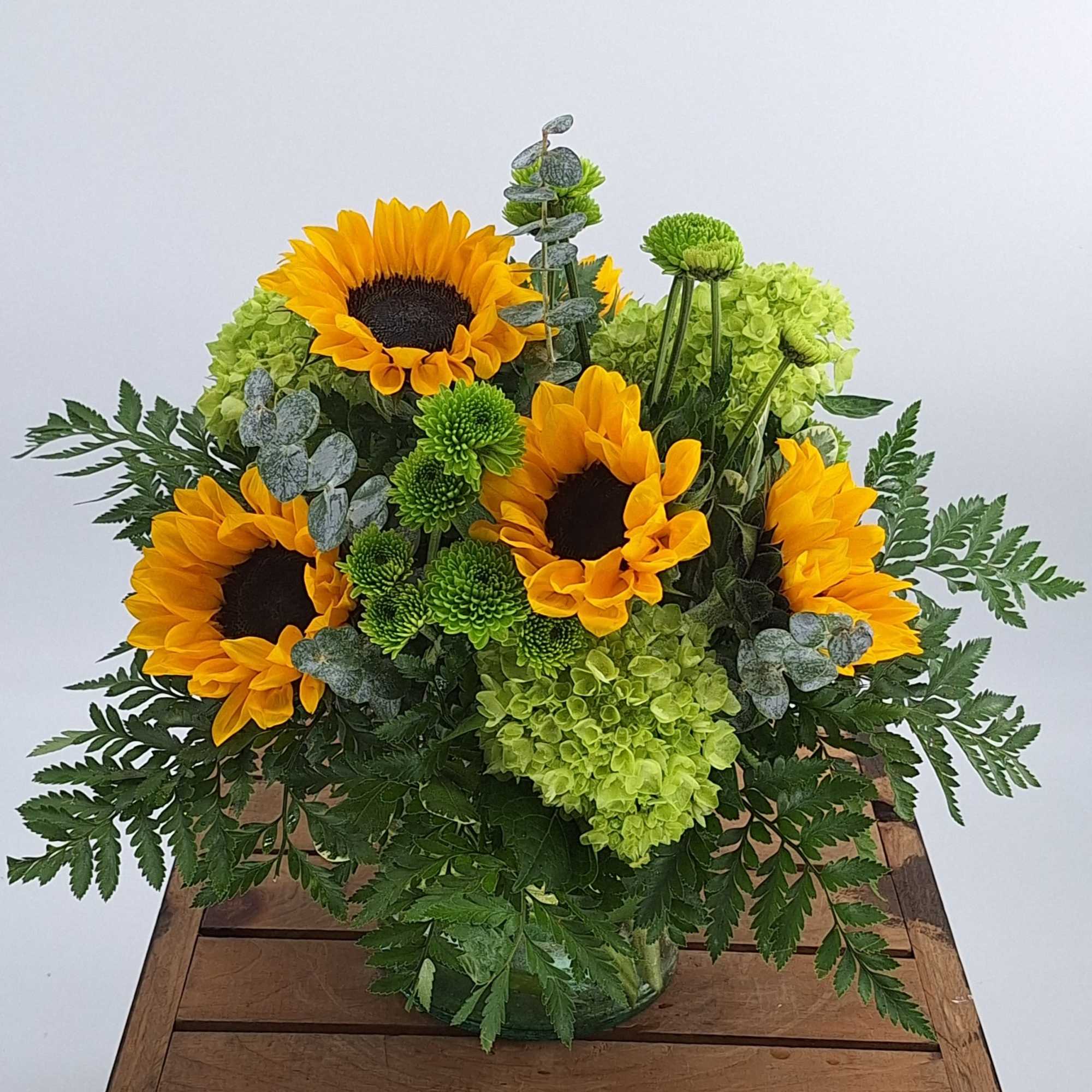 Introducing the Radiant Sunshine flower arrangement, a stunning display of vibrant beauty