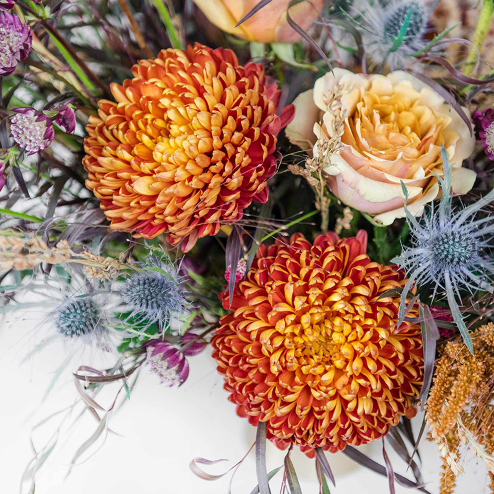 Capture the beauty of the harvest season with our Grateful Compote arrangement.