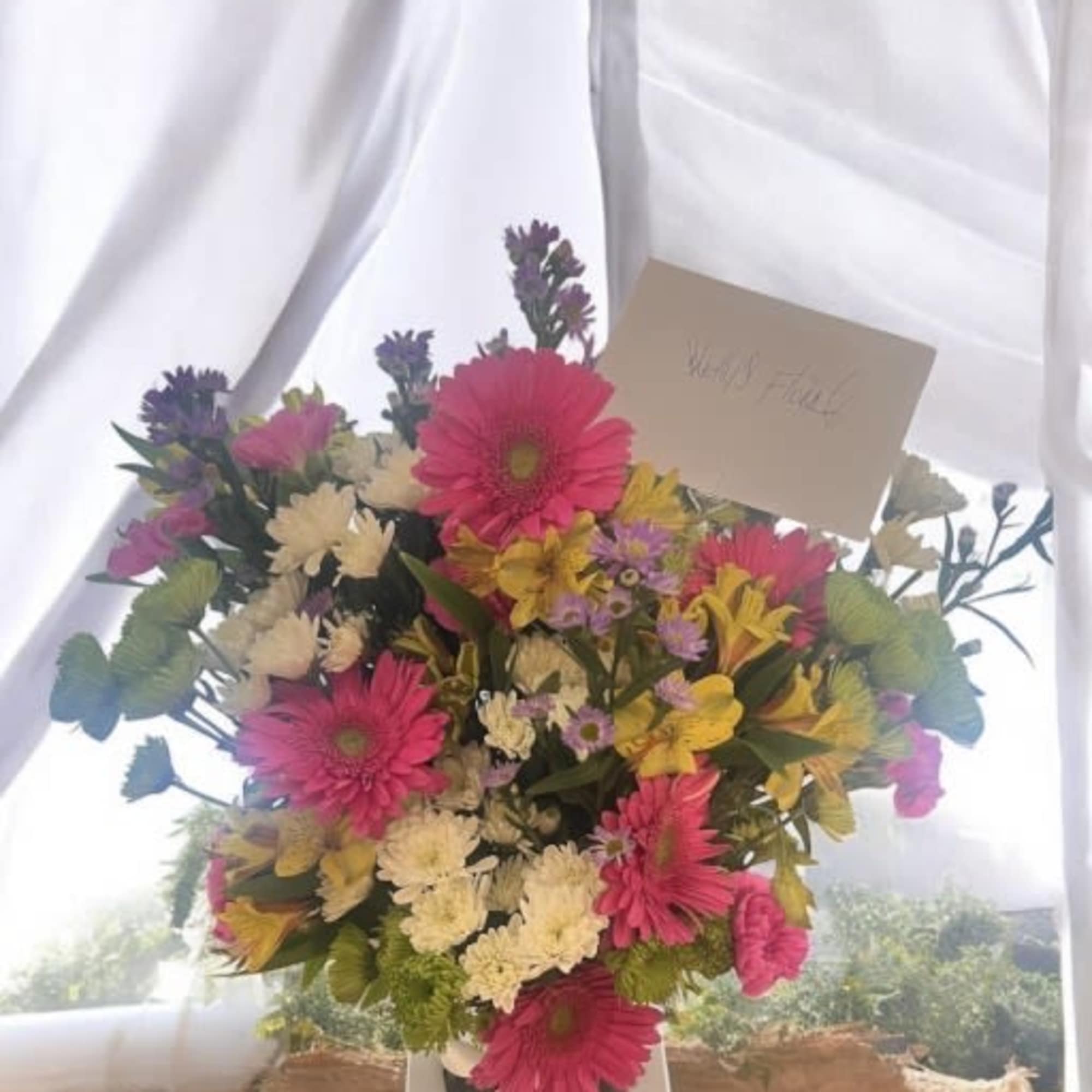 Premium Floral Arrangement

Bring sunshine, color, and life into any space with this