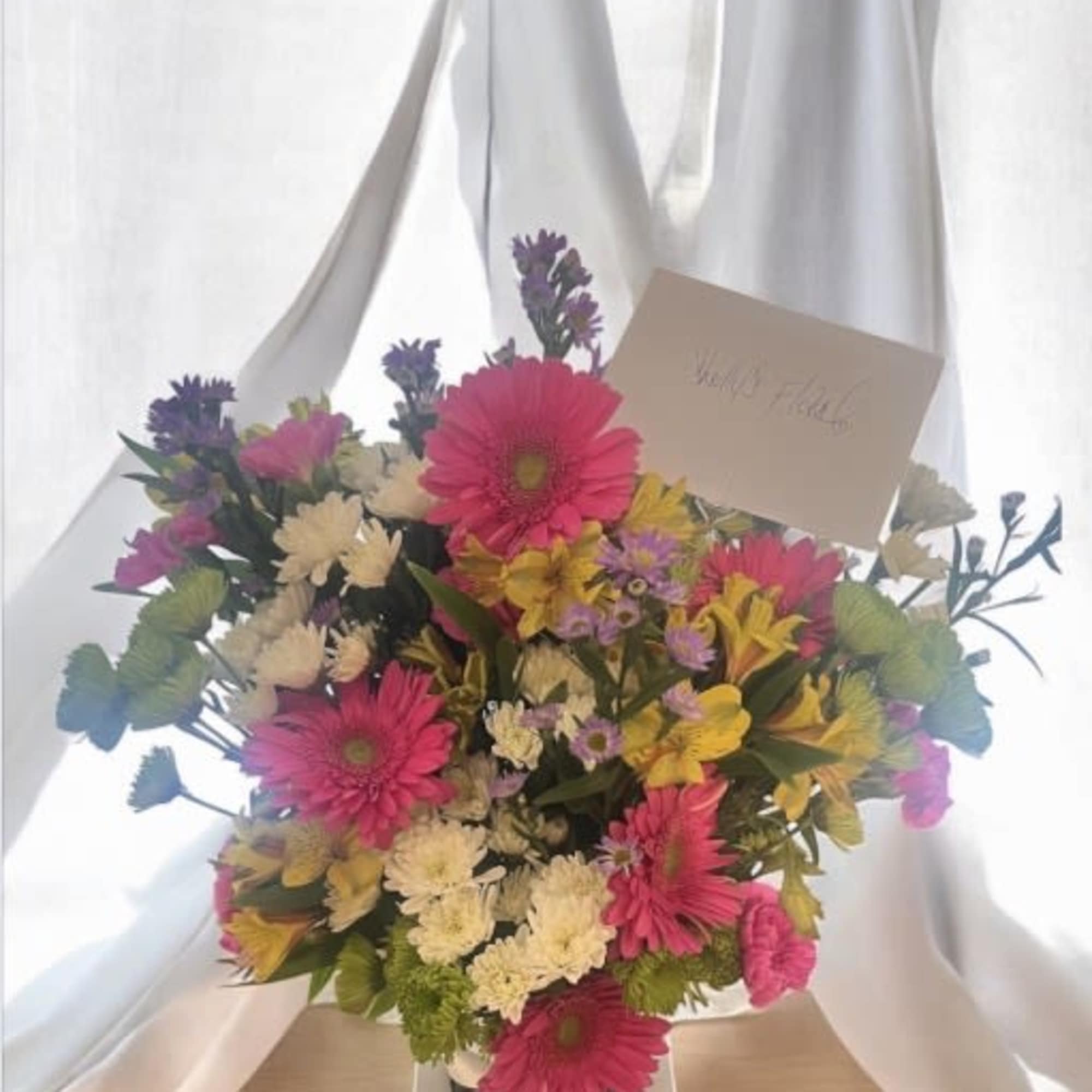 Premium Floral Arrangement

Bring sunshine, color, and life into any space with this