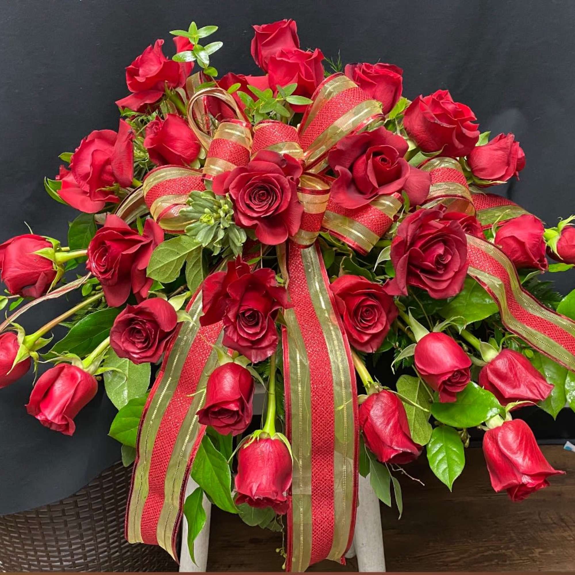 Closed casket red rose spray