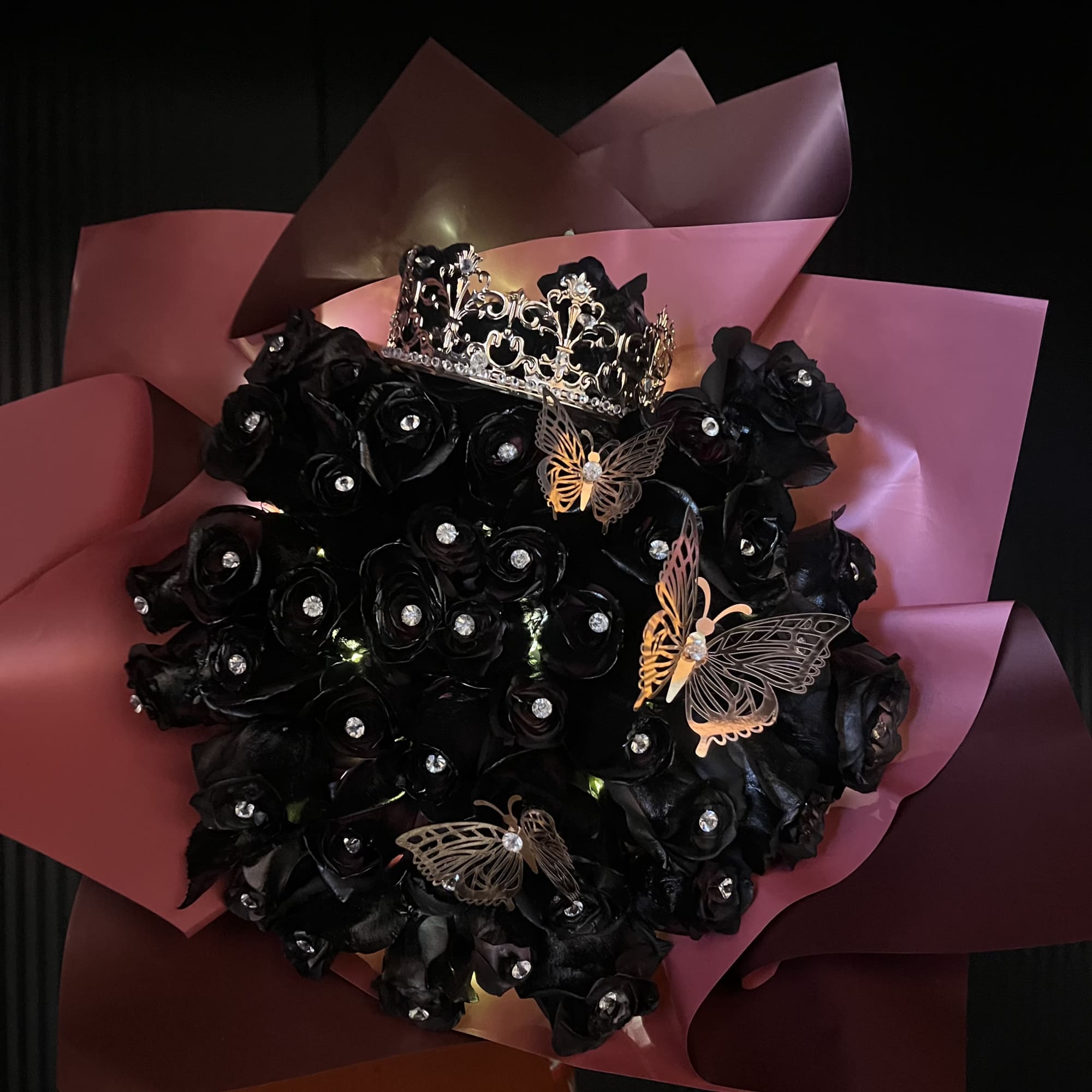 50 black painted roses with gem pins in each rose, foiled butterflies