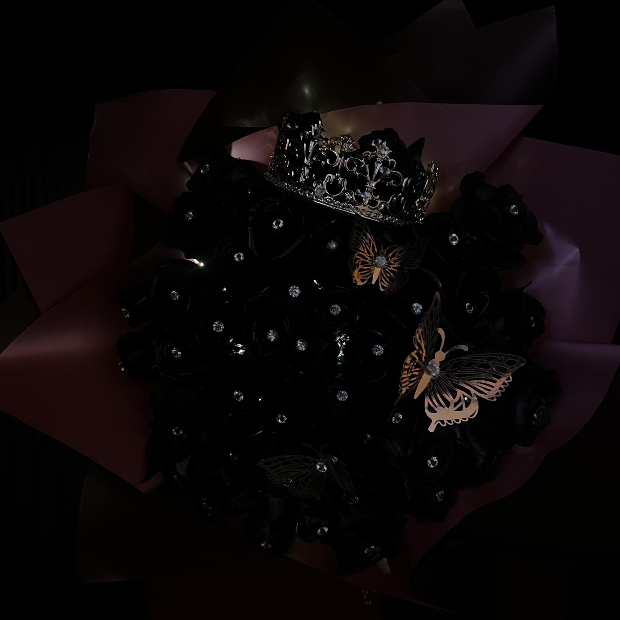 50 black painted roses with gem pins in each rose, foiled butterflies