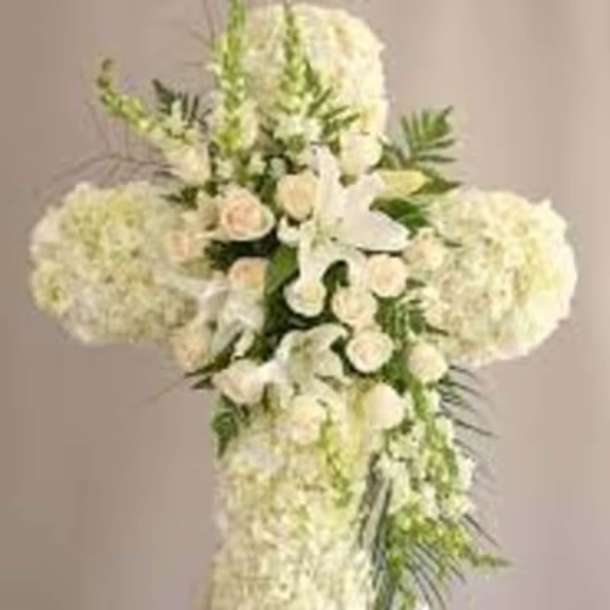 An elegant tribute for a loved one, softly colored roses, lilies, alstroemeria