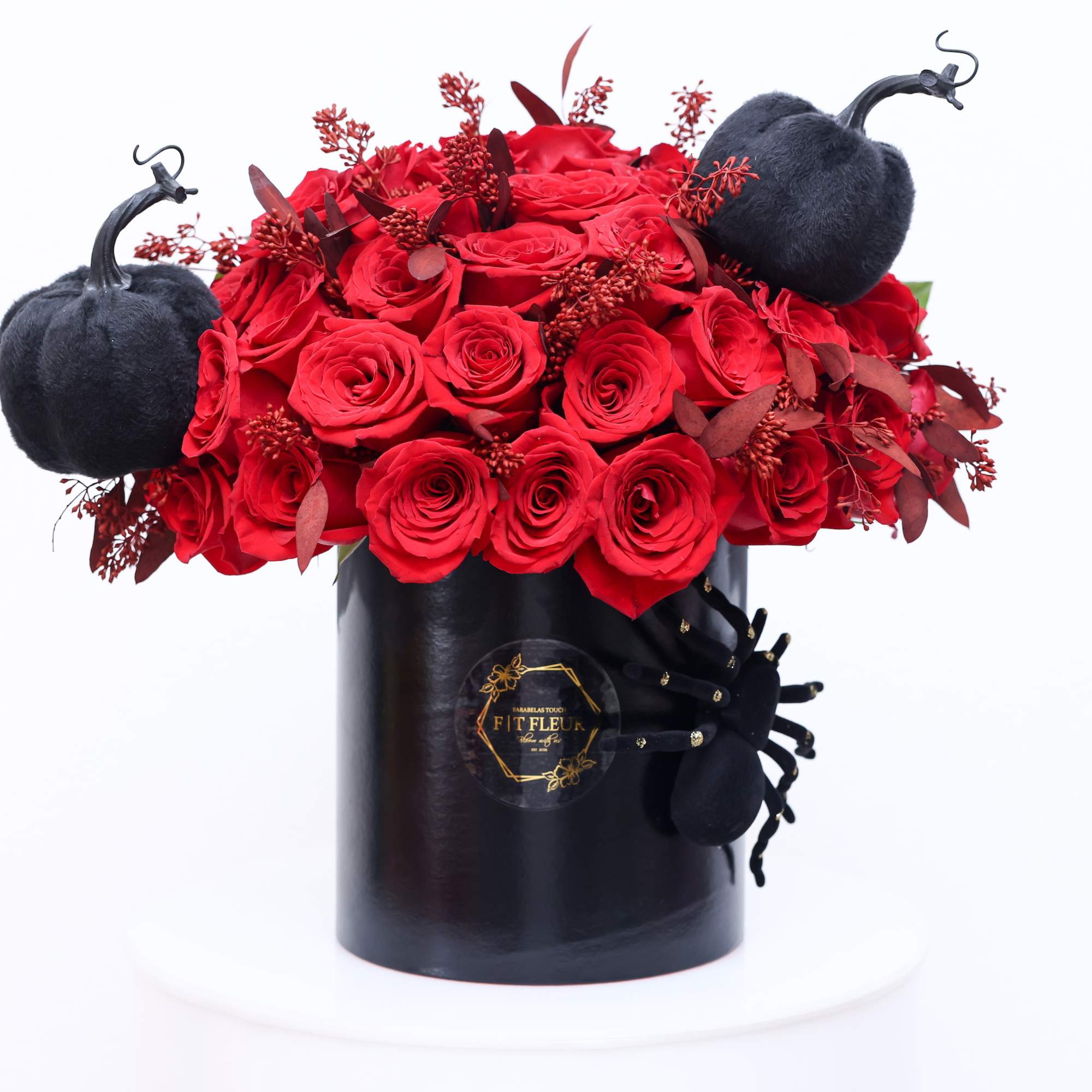 Halloween inspired Hat box arrangement designed with red roses all around.


Due to