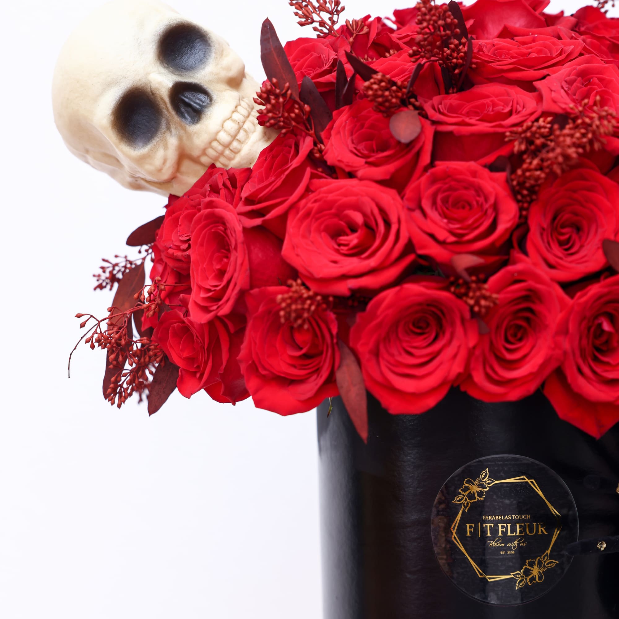 Halloween inspired Hat box arrangement designed with red roses all around. 


Due