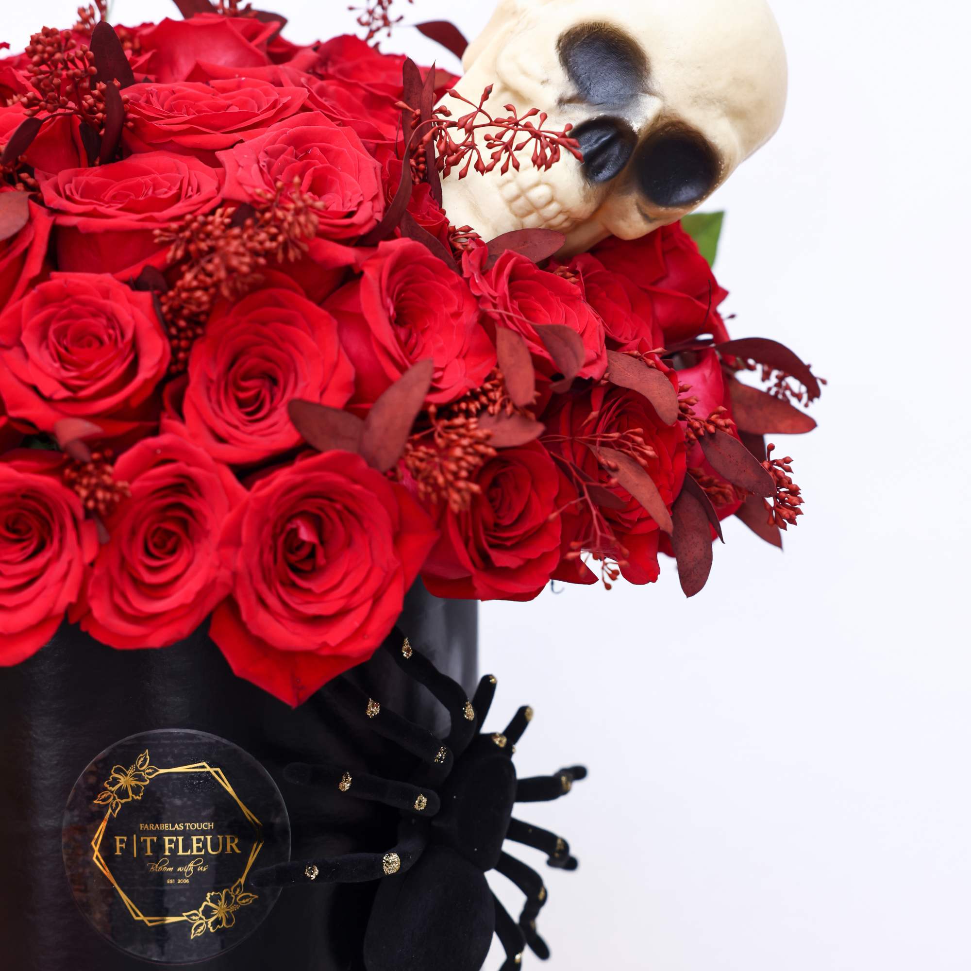 Halloween inspired Hat box arrangement designed with red roses all around. 


Due