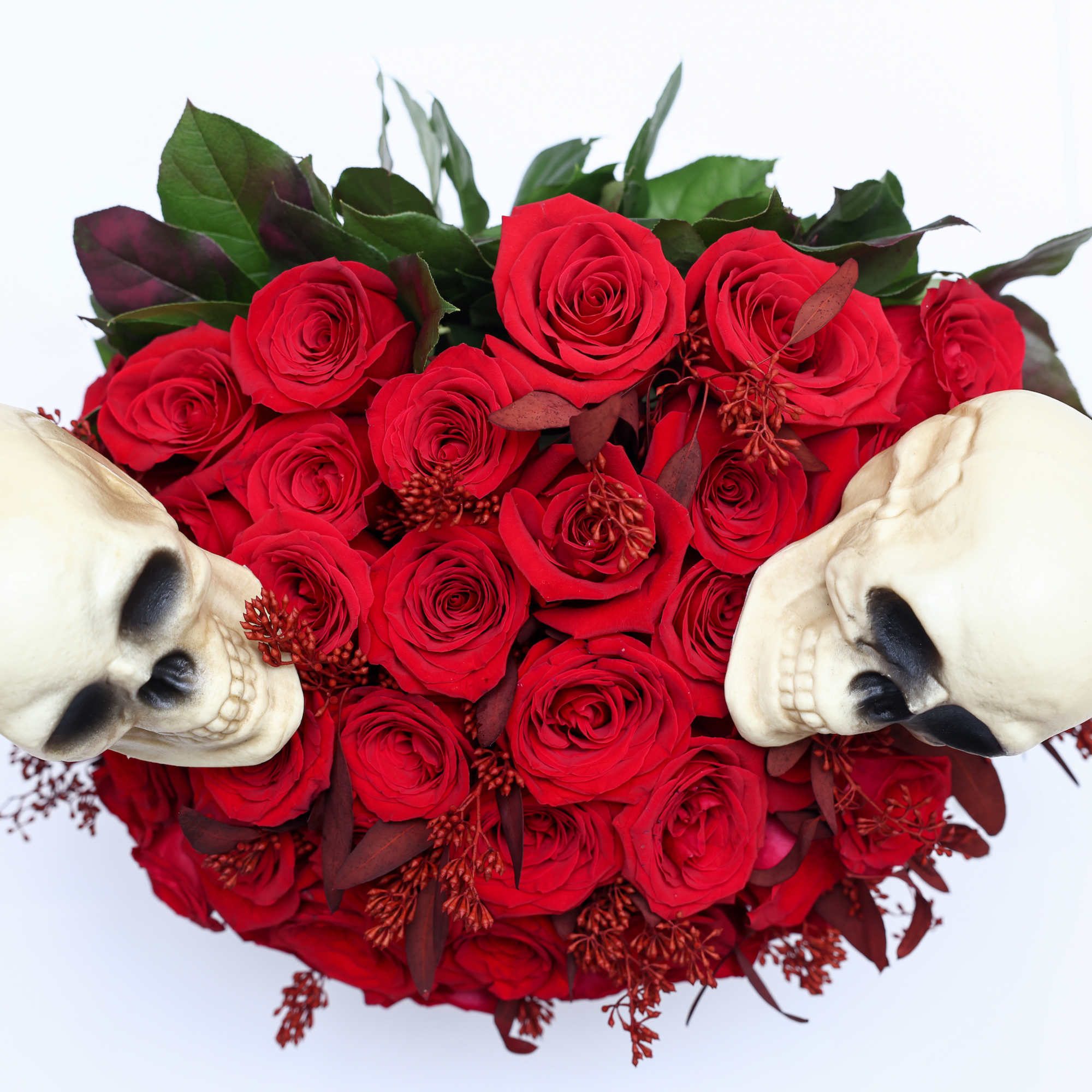 Halloween inspired Hat box arrangement designed with red roses all around. 


Due