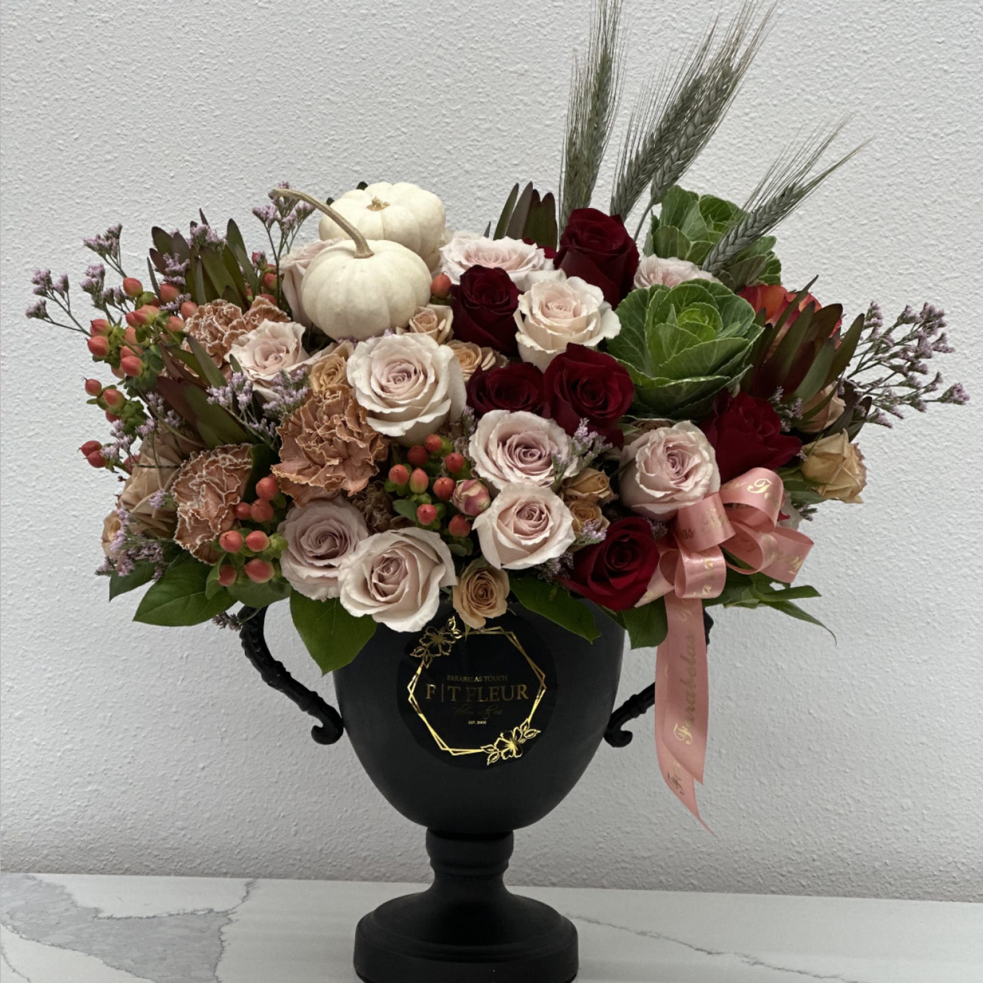 Invite fall beauty to the table with elegant arrangement, presented in a
