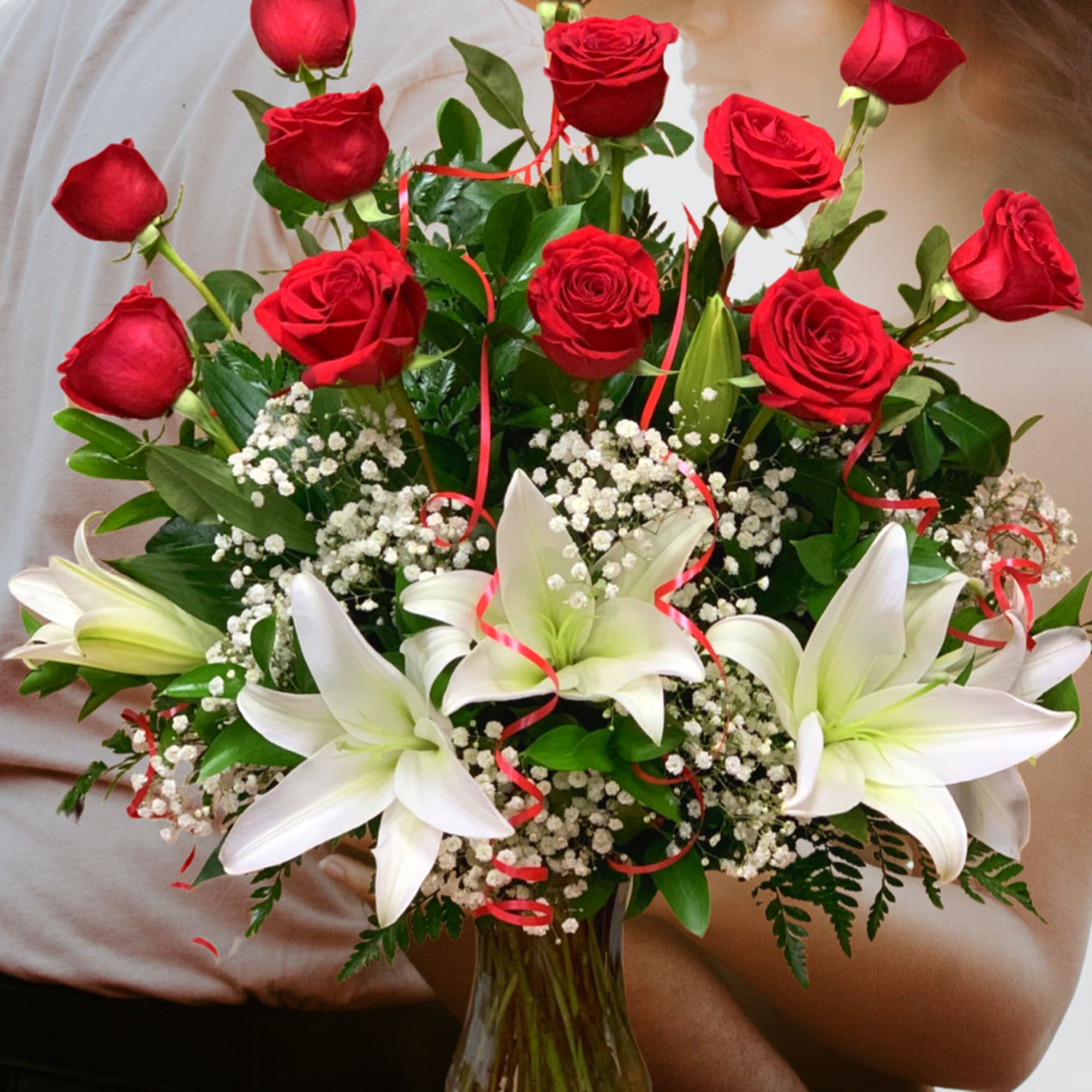 12 Long Stems Premium Roses arrived perfectly arranged in a glass vase