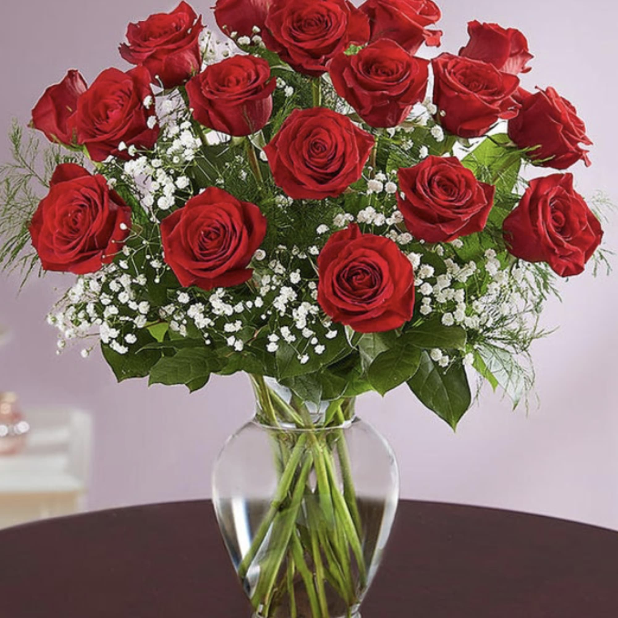These dozen red roses are the classic symbol of love and romance These dozen red roses are the classic symbol of love and romance