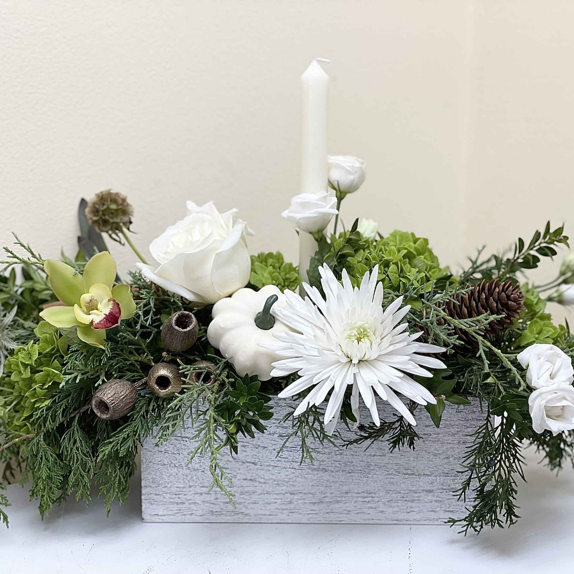 A beautifully designed centerpiece to grace a holiday table, designed with a