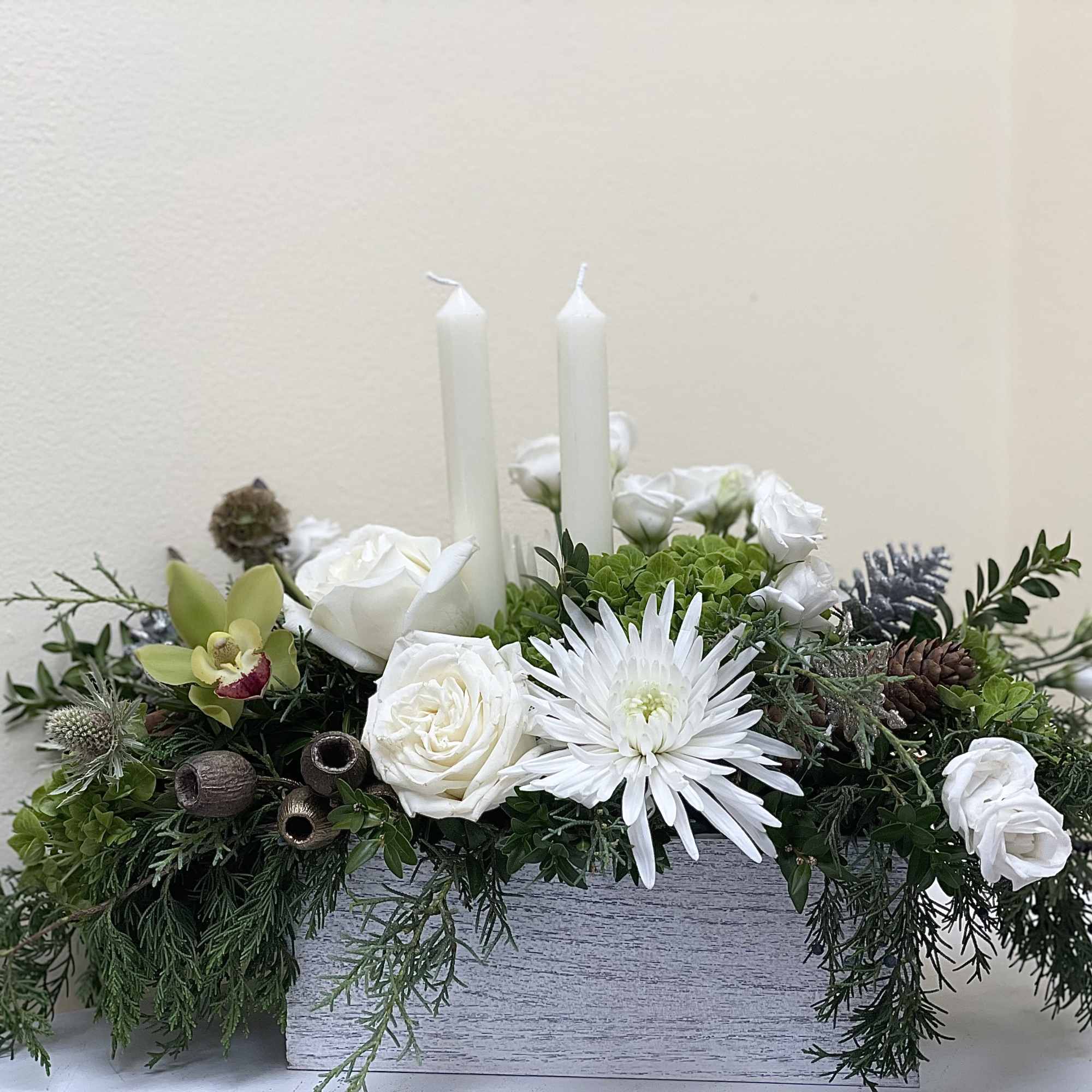 A beautifully designed centerpiece to grace a holiday table, designed with a