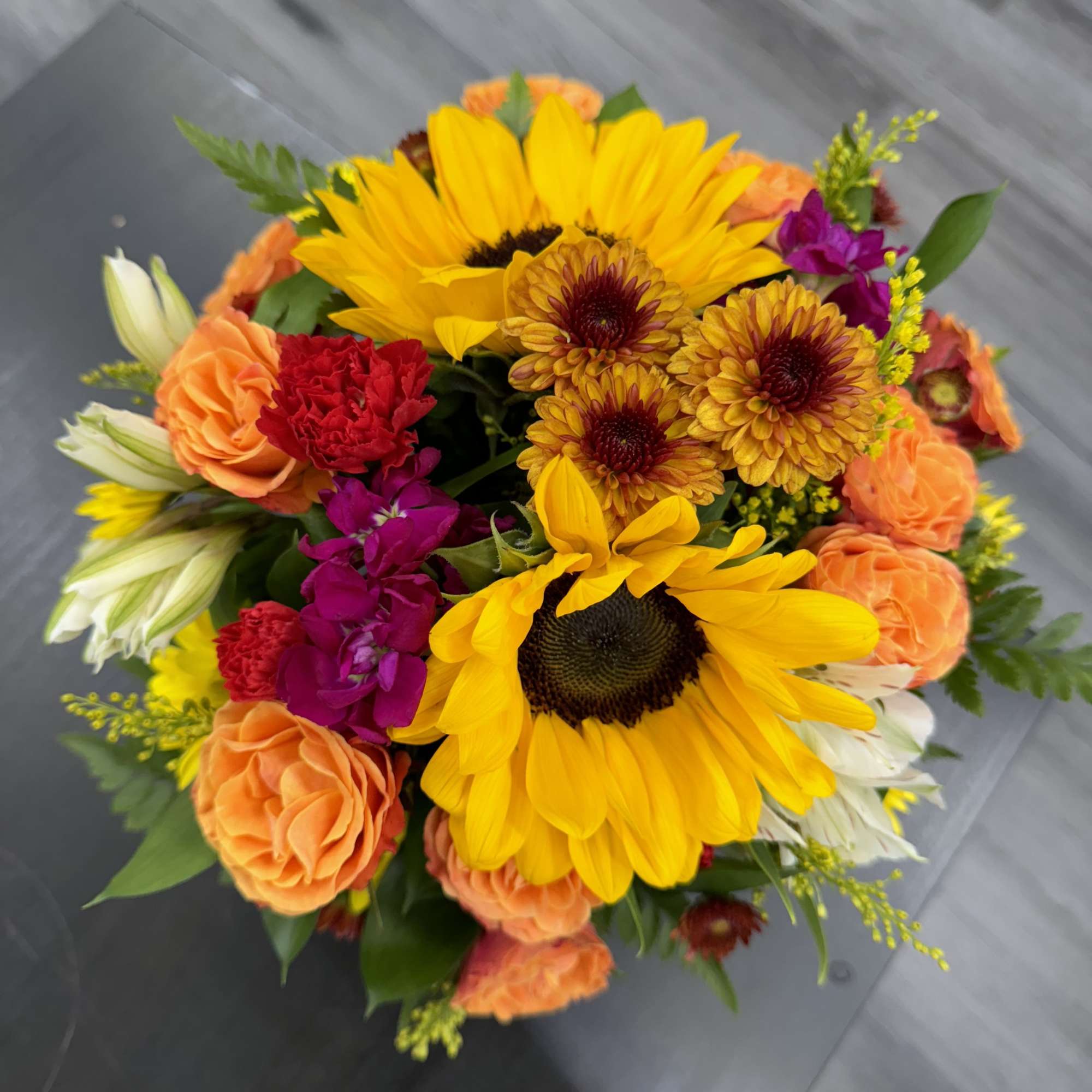 Description: Brighten up any corner with this charming arrangement in a &lsquo;happy